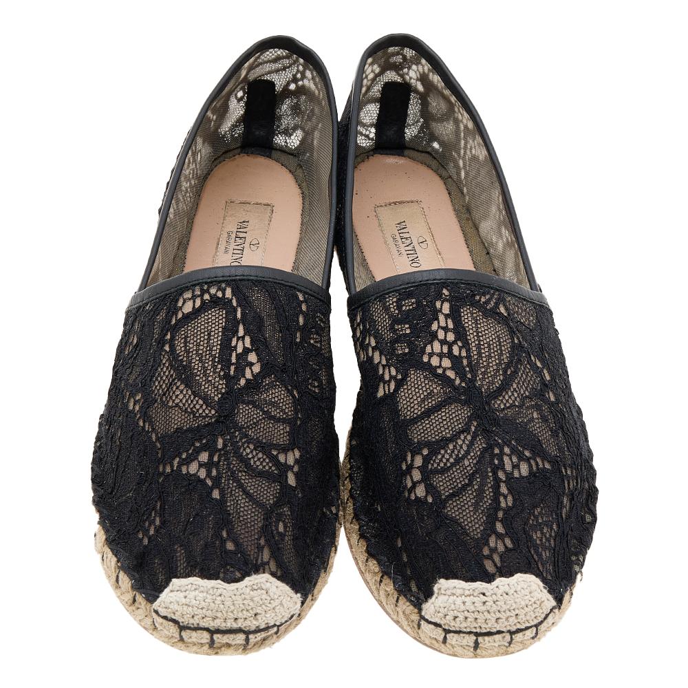 These espadrille flats from the House of Valentino will keep your feet stylish and comfortable all day. They are crafted using black lace on the exterior. They showcase a mesh lining and an easy slip-on feature. Look classy as you wear these
