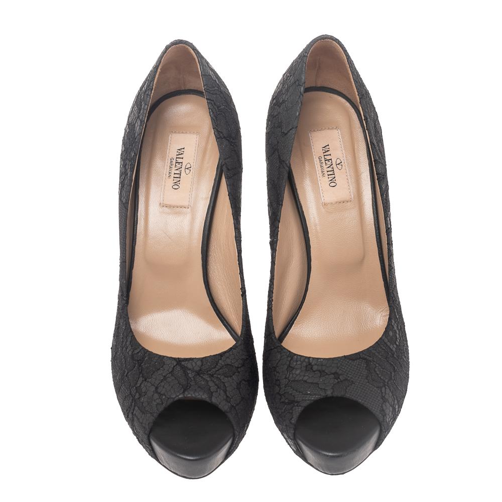 Valentino's elegant flair and feminine sensibilities are evident in these pumps! They are crafted from leather then overlaid with delicate lace into a peep-toe silhouette. These pumps are elevated on stiletto heels.

