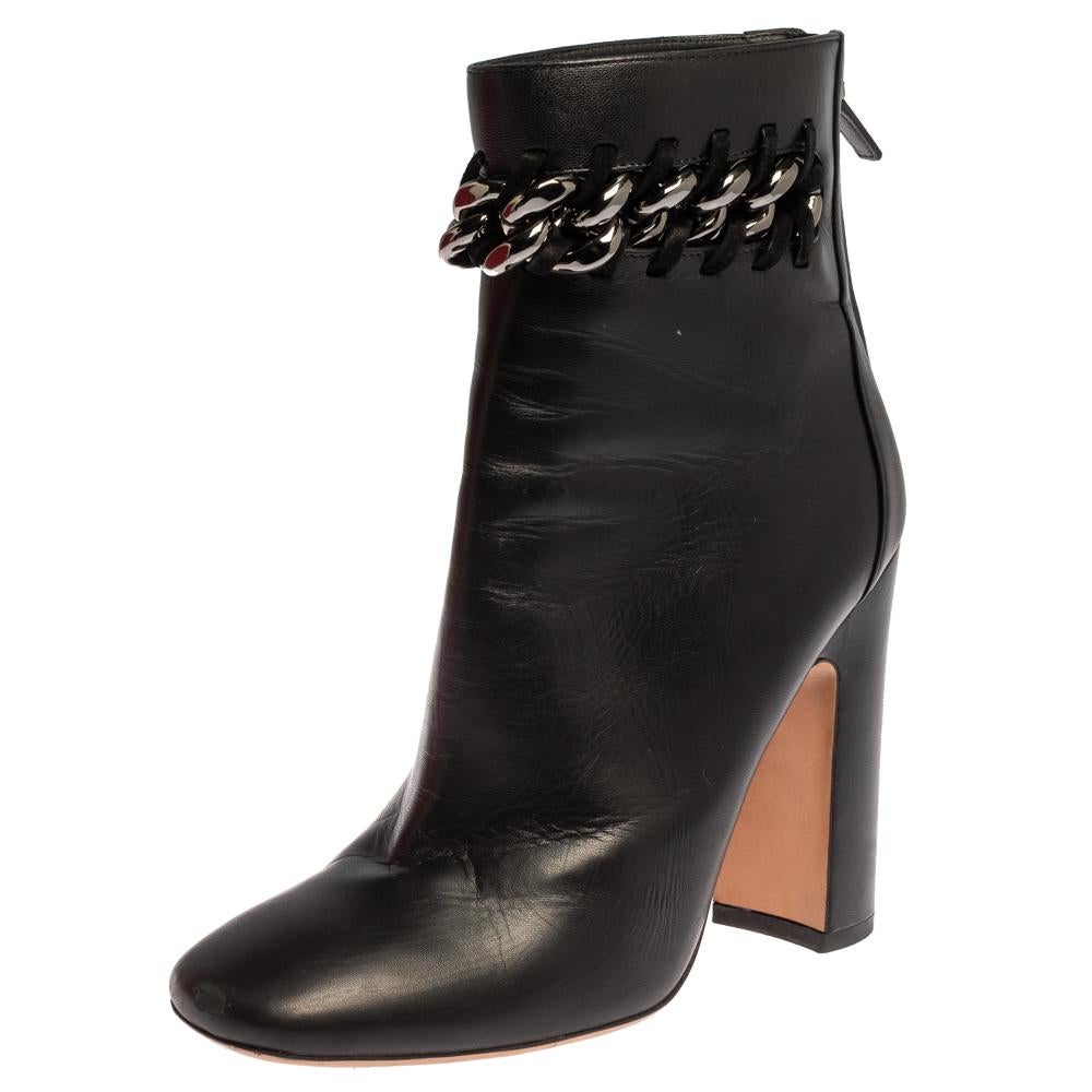 Valentino promises to elevate your style with this fabulous pair of boots. Built to last and add sophistication, these black leather boots are all you need. They have been styled with square toes and a gunmetal-tone chain-link detailing. They are