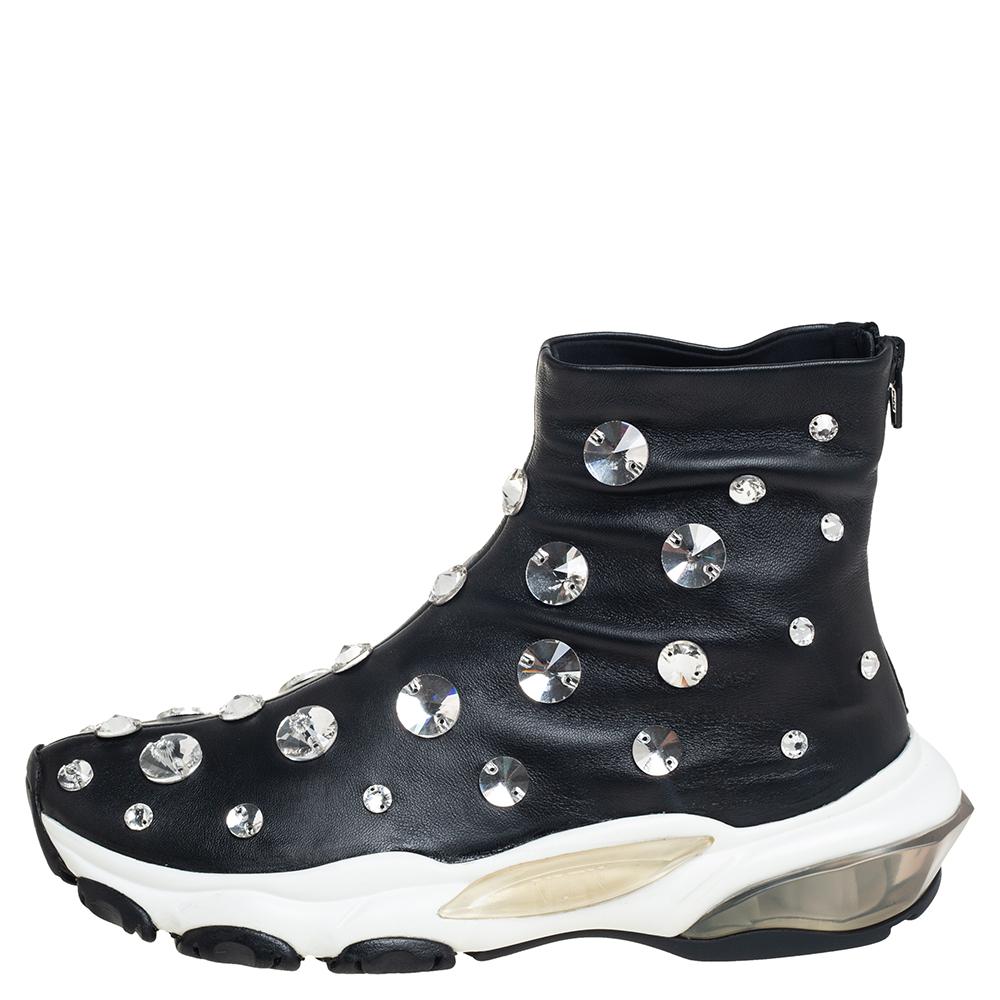 Bring home the luxurious high-fashion touch with these sneakers from Valentino. Crafted from leather, these black high-top sneakers come flaunting impressive details like the dazzling crystal embellishments, a sock-like silhouette, chunky midsoles,