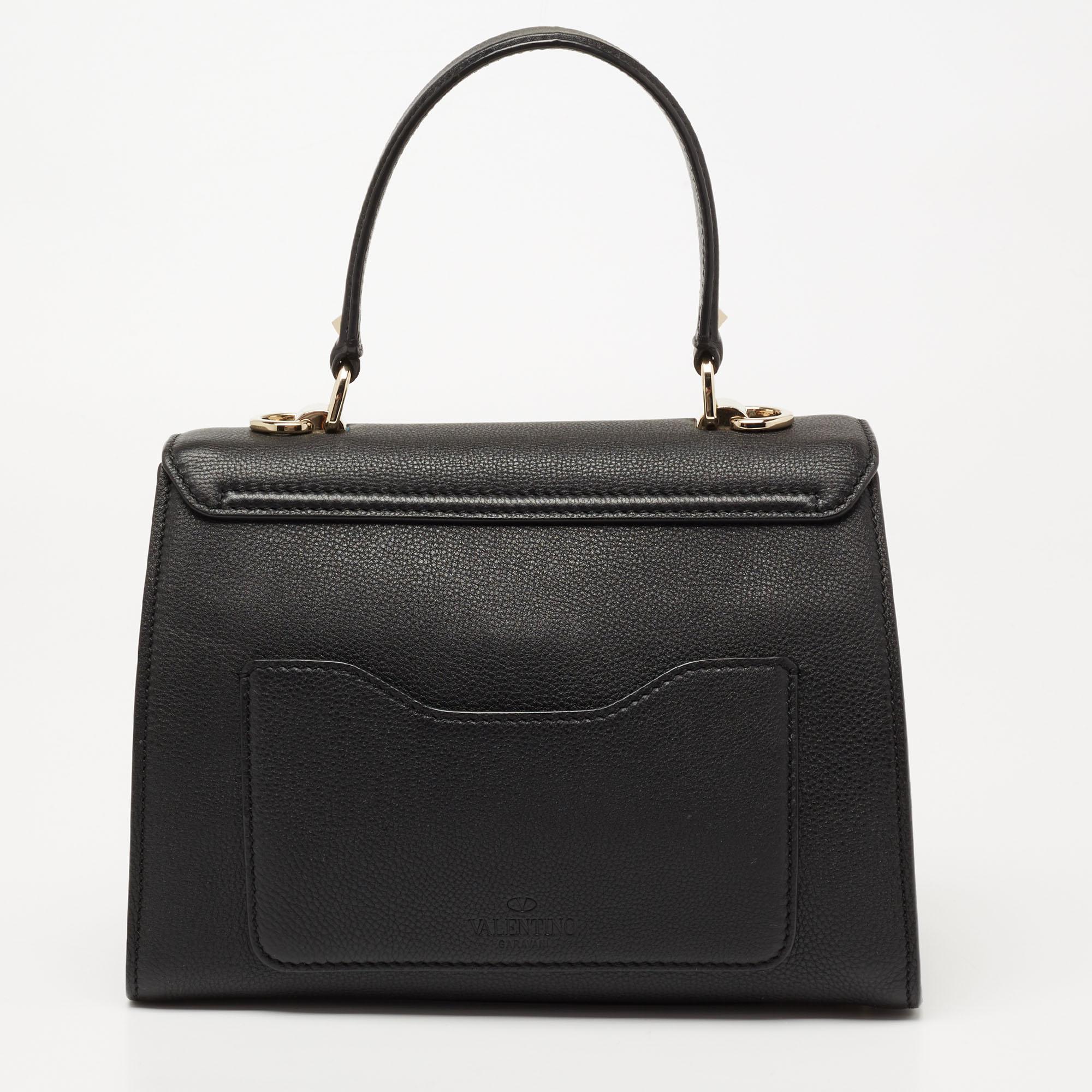 This bag from Valentino is an accessory you would go to season after season. It has been crafted from black leather into a flap style. It comes with a top handle, crossbody strap, and suede lining.

Includes: Original Dustbag, Info Booklet, Extra