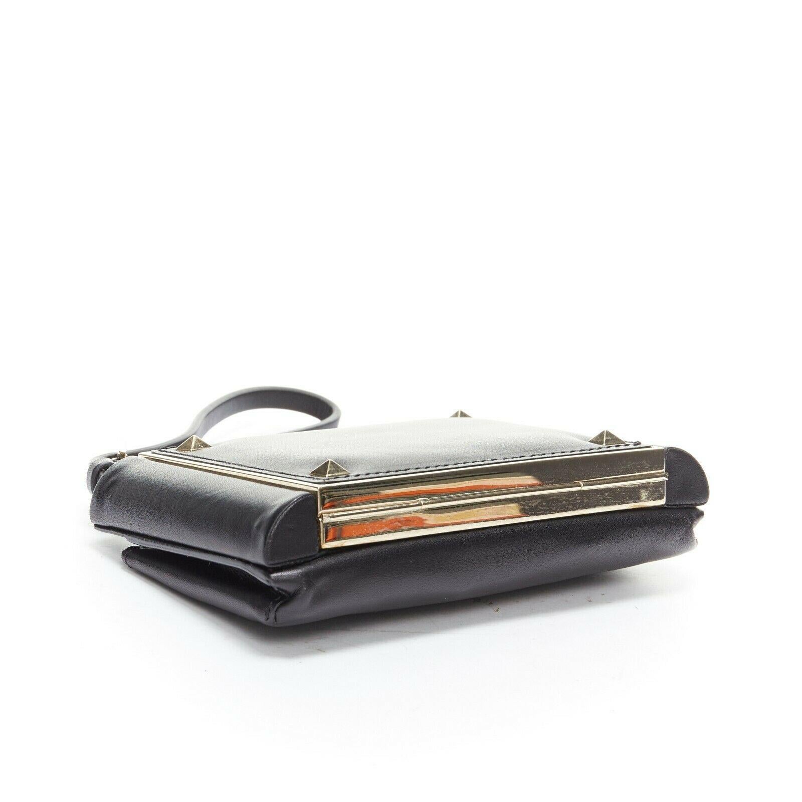 Women's VALENTINO black leather gold Rockstud metal frame minaudiere clasp clutch bag