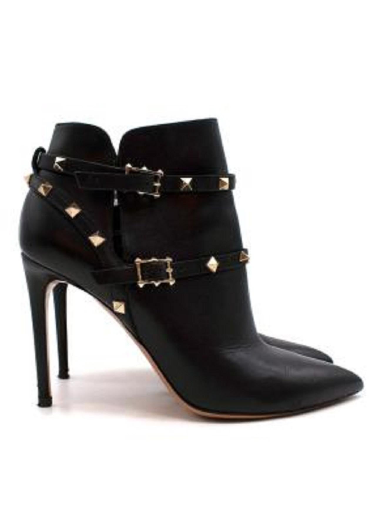 Valentino Black Leather Rockstud Ankle Boots

- Smooth calfskin
- Split sides
- Gold signature rockstuds
- Rockstud harness fastening
- Adjustable buckle ankle fastening
- Pointed and covered toe
- Stiletto heel
- Padded leather insole
- Covered