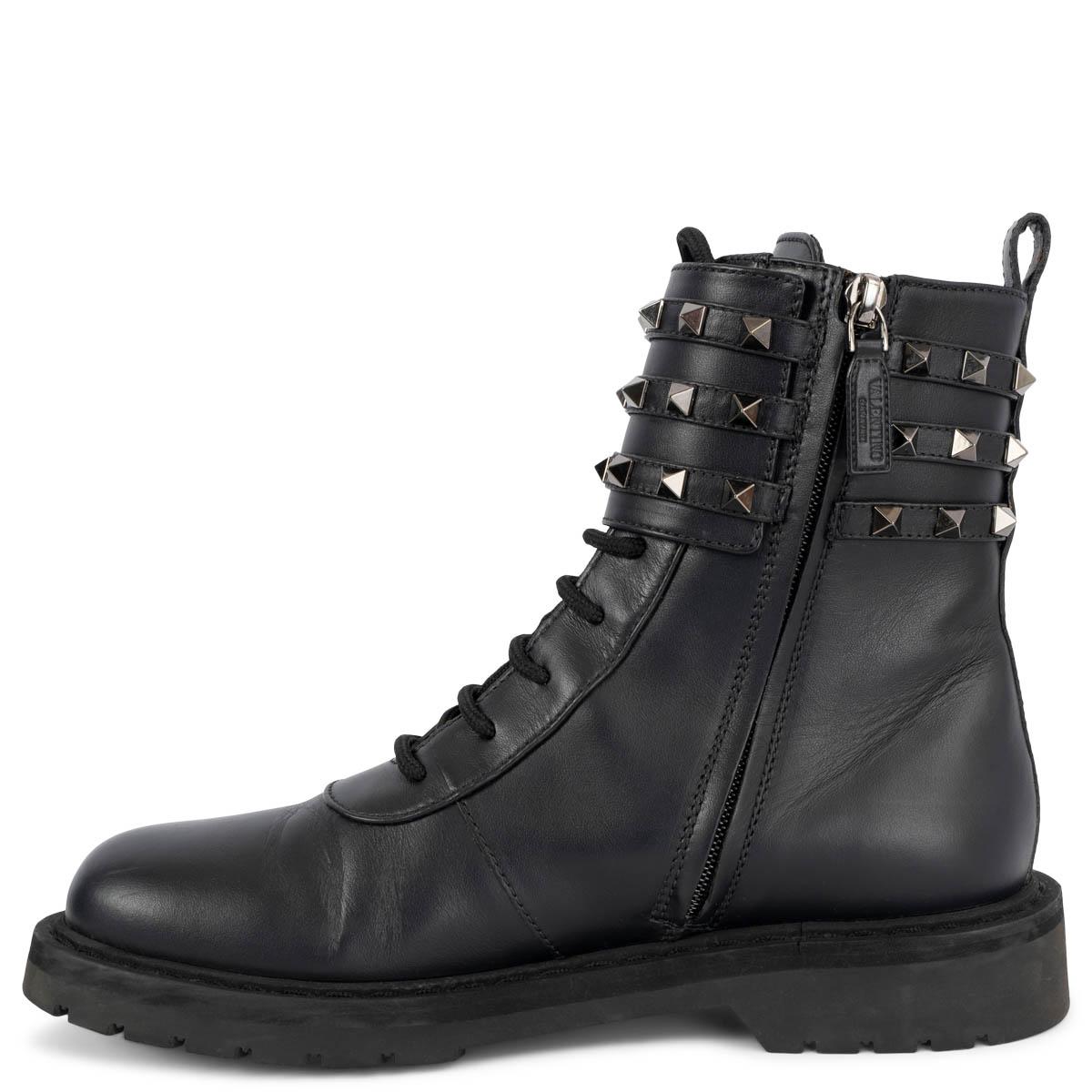 100% authentic Valentino Rockstud buckled combat boots in black smooth calfskin embellished with gunmetal studs. Open with concealed zip fastening along the inside and are set on a black rubber sole. Have been worn and are in excellent condition.