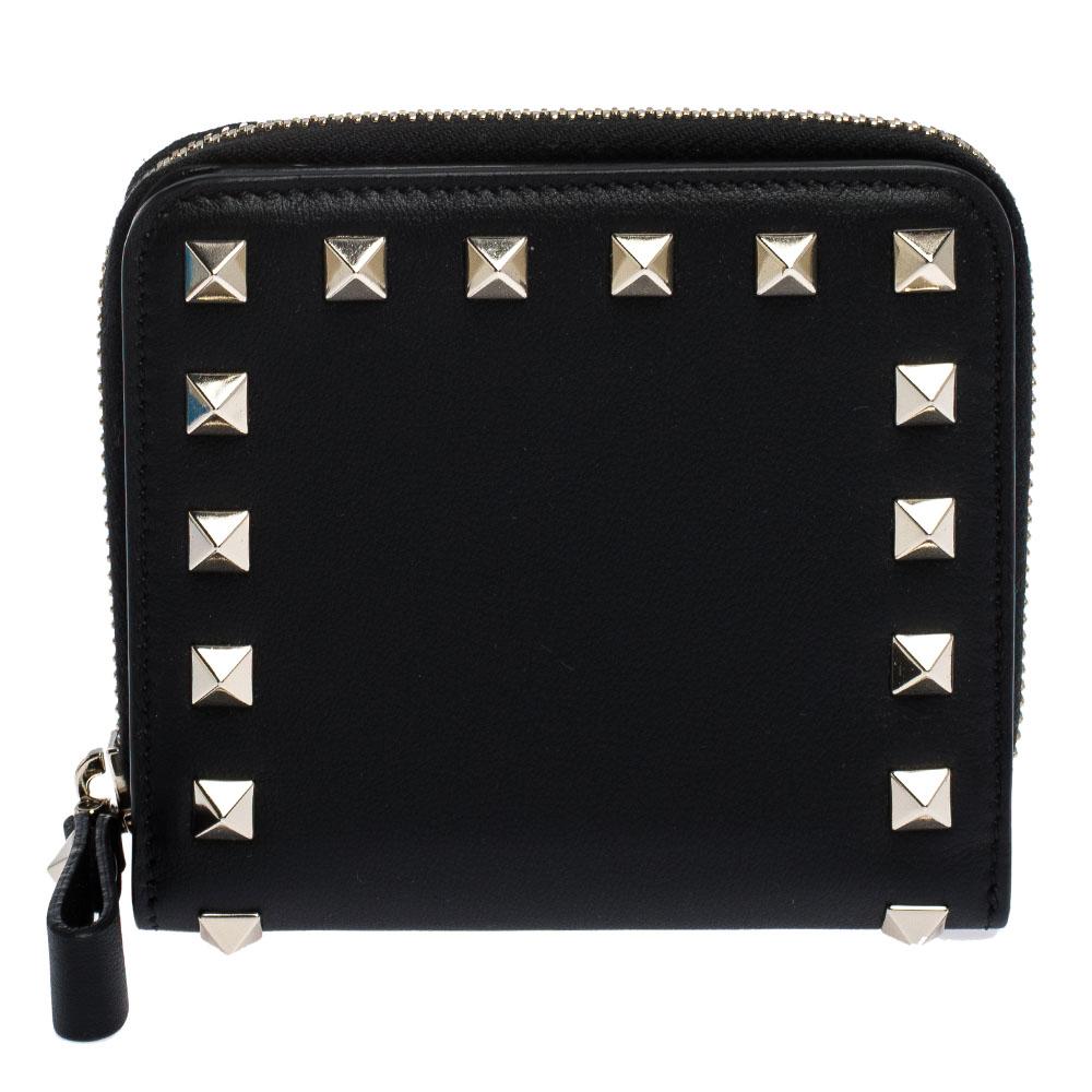 This coin purse is a lovely creation from the house of Valentino. Crafted from leather, it is decorated with signature Rockstuds and the brand logo at the back. The zip-secured interior has enough space to hold your coins.

Includes: Original Dustbag