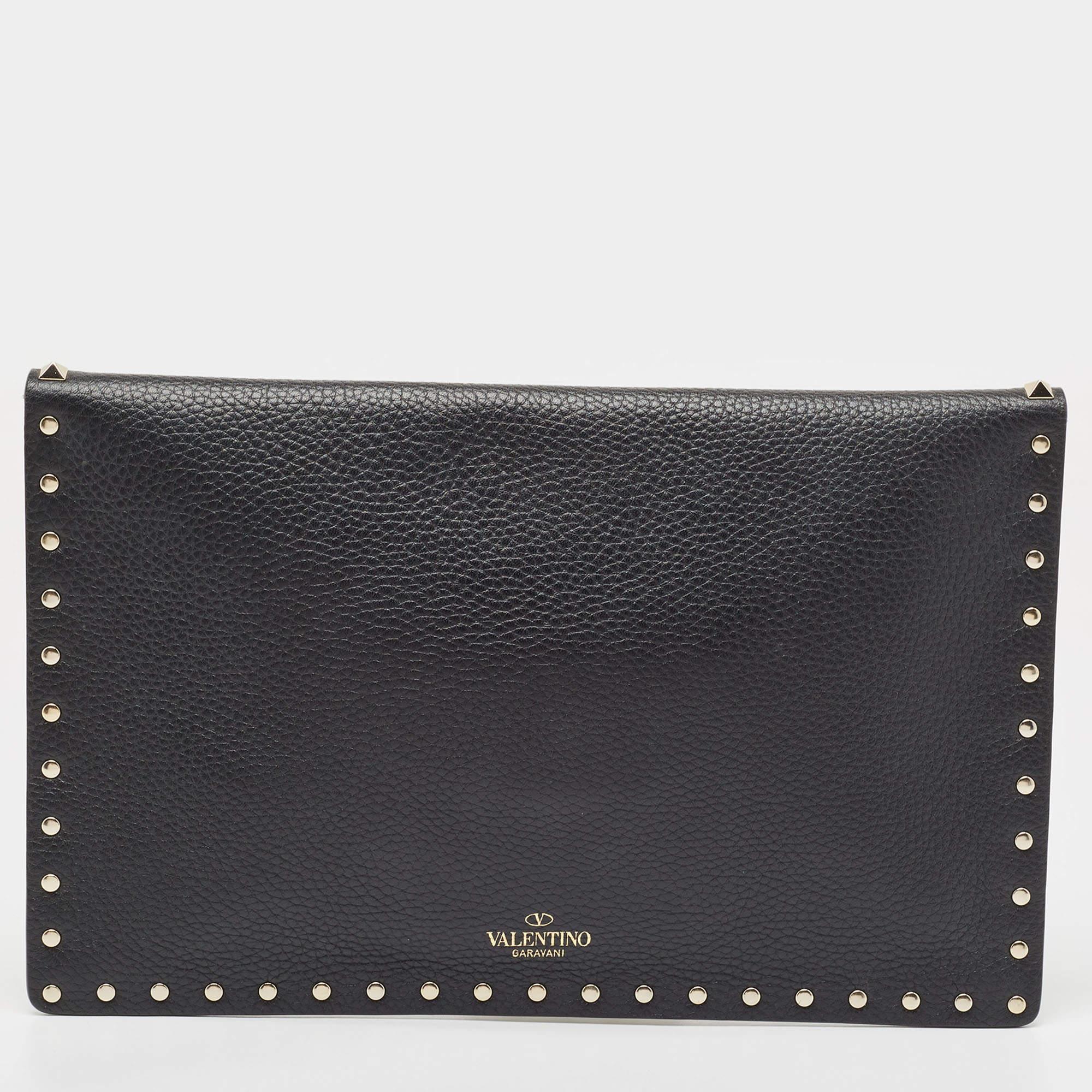 The Valentino pouch exudes sophistication with its sleek black leather and signature Rockstud detailing. Perfectly sized to hold essentials, it offers a luxurious feel with a touch of edge, making it a timeless accessory for any stylish
