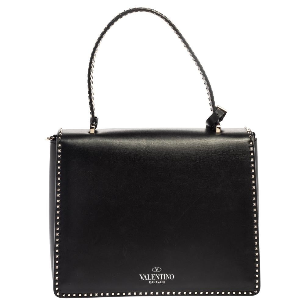 Known for its high quality and brilliant finish, this stunning bag from Valentino will be your companion for years to come. Fashioned with quality leather in Italy, this sleek piece is perfect for a host of occasions. It has a black hue, flat top