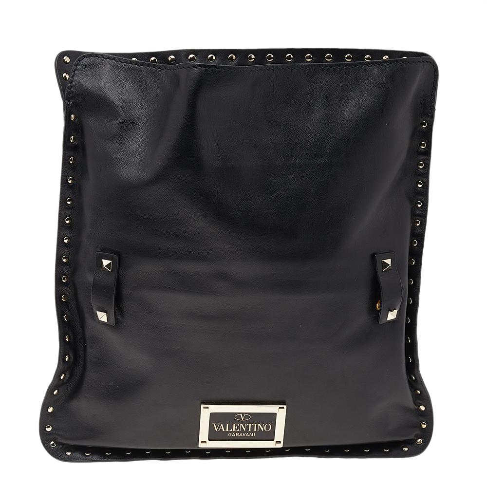 Durable and practical, this Valentino messenger bag will keep all your needs handy. Detailed with the Rockstud motifs, it projects a luxe look. It has a front flip lock, a spacious interior, and a studded shoulder strap.

Includes: Original Dustbag