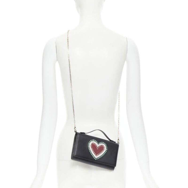 VALENTINO black leather Rockstud green red heart gold chain wallet clutch
Reference: TGAS/B01415
Brand: Valentino
Designer: Pier Paolo Piccioli
Model: Heart studded wallet on chain
Material: Leather
Color: Black
Pattern: Solid
Closure: