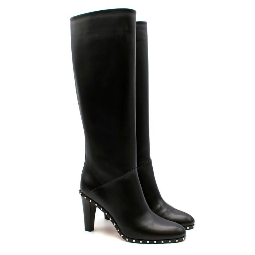 Valentino Black Knee High Heeled Boots

- Side zip
- Studded detail around sole
- Heeled boot
- Round toe box
- 9cm/90mm heel 
- Back seam 
- Seam detail across front

Materials:
100% Leather

Made in Italy

Please note, these items are pre-owned