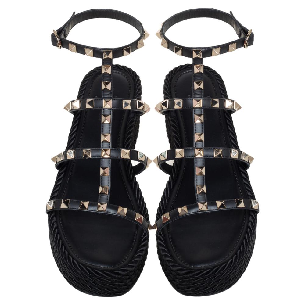 Valentino adorns these sandals' neat silhouette with its signature Rockstuds for a feminine and edgy look. They're impeccably crafted in Italy from leather to open toes. Wear them with a printed blouse tucked into tailored trousers.

Includes: