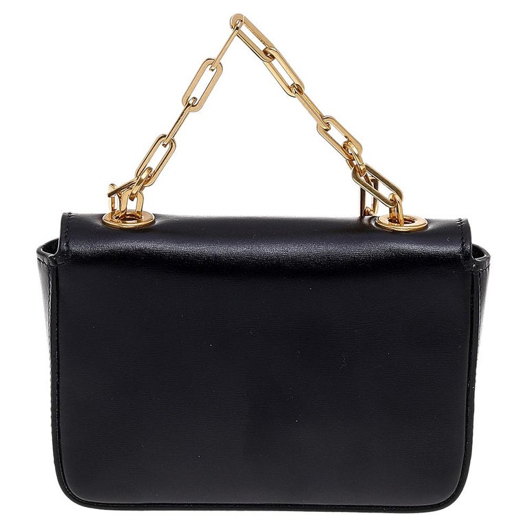 Elevate your style with this gorgeous shoulder bag by Valentino. Crafted from leather, the bag offers a classy look. It has gold-tone hardware, an eye-catching Gryphons motif on the flap, and a well-sized interior.

