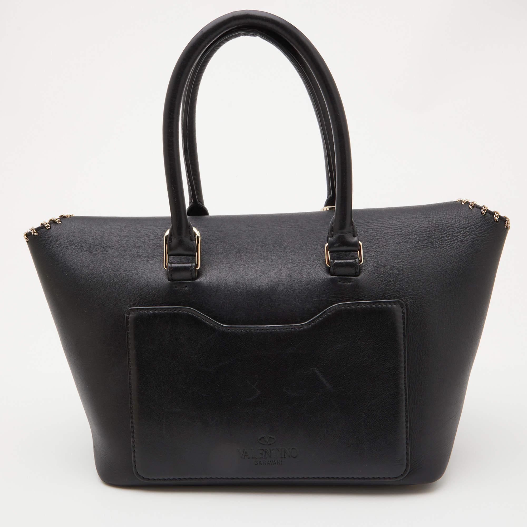 Valentino is known for its multi-functional designs, and this handbag is no different. A versatile accessory, you can use this leather bag for multiple occasions. The interior is lined with luxurious suede and is secured by a flap.

Includes: