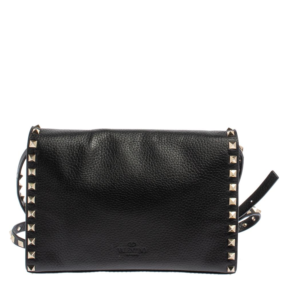 Bags are more than just a means to carry one's essentials. They express a woman's sense of style. Valentino brings you one such fabulous bag meticulously made from black leather. This crossbody bag has a well-sized suede interior and the brand's