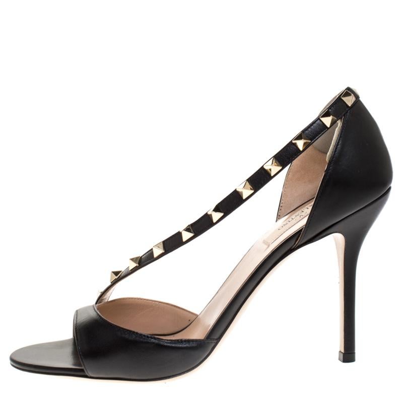 Walk with confidence knowing you are looking fashionable when you step out in these sandals from Valentino. They are crafted from leather and detailed with Rockstud accents and cuts. The open-toe sandals are set on 10.5 cm heels.

Includes: Original