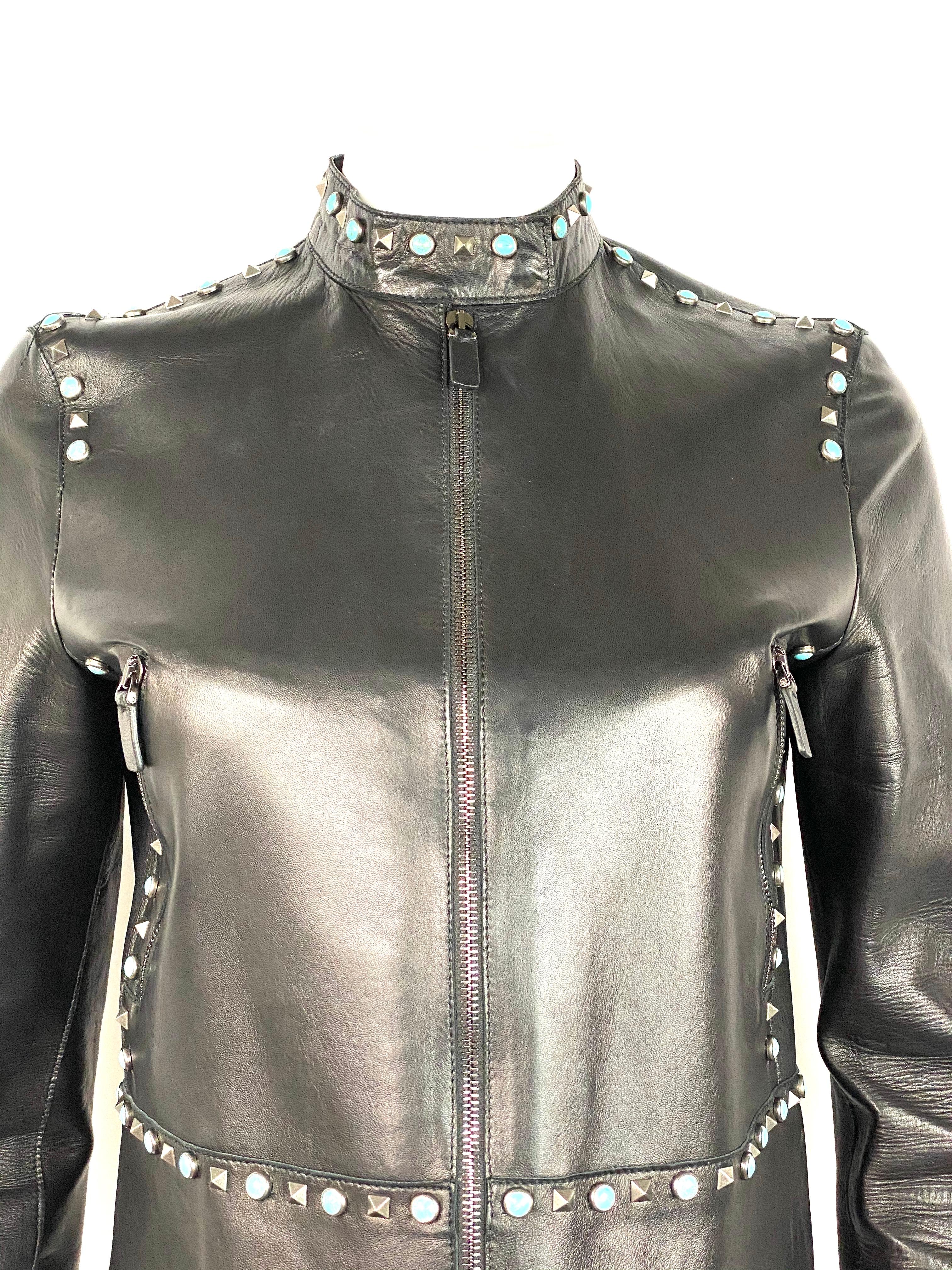 Valentino Black Leather Studded Jacket Size 8

Product details:
Size 8
Silver tone geometric and turquoise round studs detail
Collar
Zip closure
Two front zipped pockets
Two silver tone buckles on each side
One zipper detail on the bottom of each