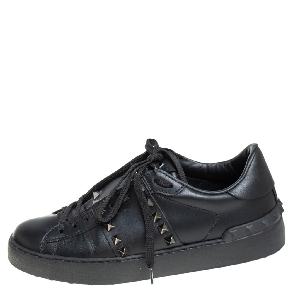 Strut out in style with this pair of sneakers from Valentino. These leather sneakers are fashionable and definitely worth the splurge. The exterior is crafted from black leather and features lace-up fronts and studded uppers. The trendy rubber sole