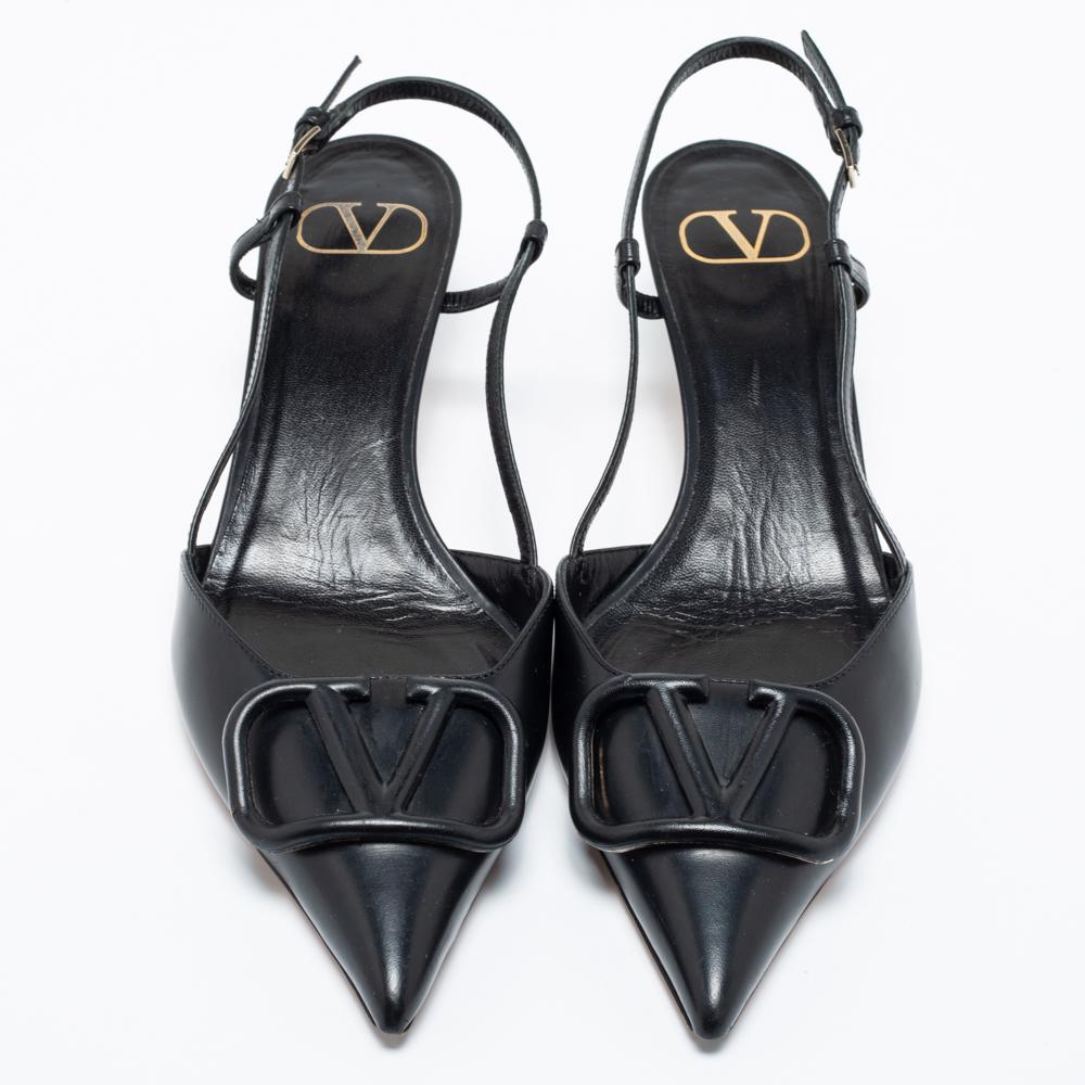 Valentino's sandals are rendered in black leather and feature a sleek pointed-toe silhouette. The uppers are adorned with a tonal VLogo for a signature touch, and the slingbacks are added as effortless fasteners. The kitten heels will go perfectly