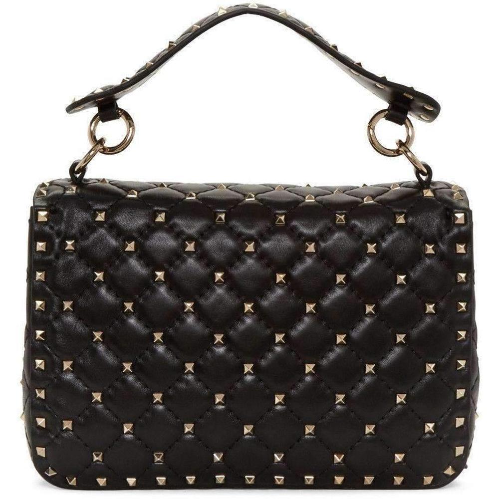 Shoulder bag in black. 
Signature pyramid stud detailing throughout. 
Detachable leather carry handle with spring-ring fastening. 
Detachable round curb chain shoulder strap with lanyard clasp fastening. 
Foldover flap with turn-lock fastening.