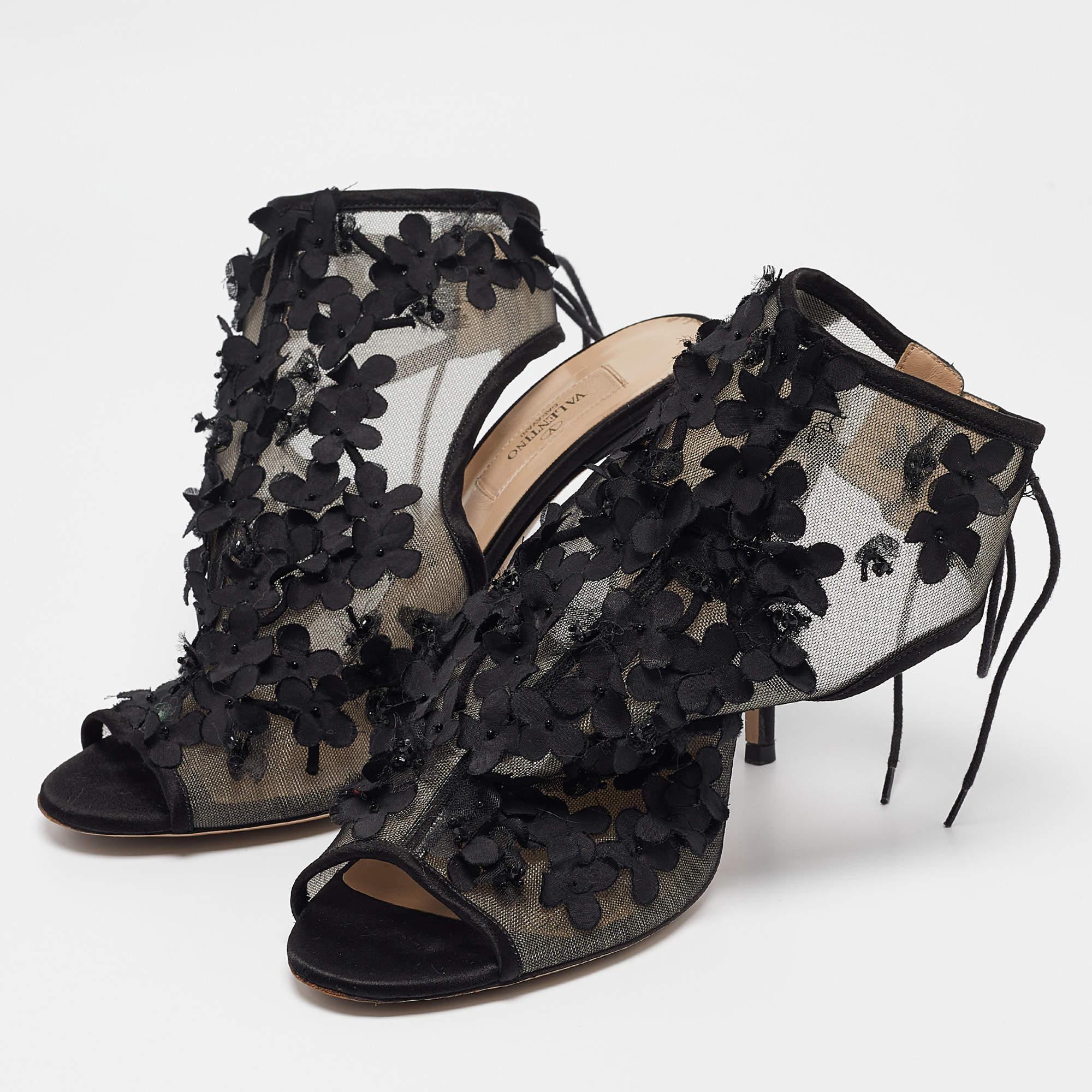 Rich in details and brimming with elegance these ankle tie sandals from Valentino are one of a kind Crafted from mesh these black sandals feature an open toe silhouette. They flaunt floral applique on the vamp strap and secure your feet with ankle