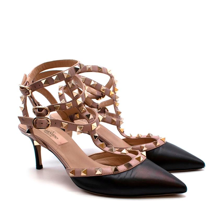 Valentino Black & Nude Leather Rockstud Caged Pumps 65mm

- Made of soft leather 
- Cage like style 
- Kitten heels 
- Platinum finish studs 
- Piping and ankle straps in contrast poudre Napa 
- Adjustable buckle closures 
- Pointy toes
- Iconic