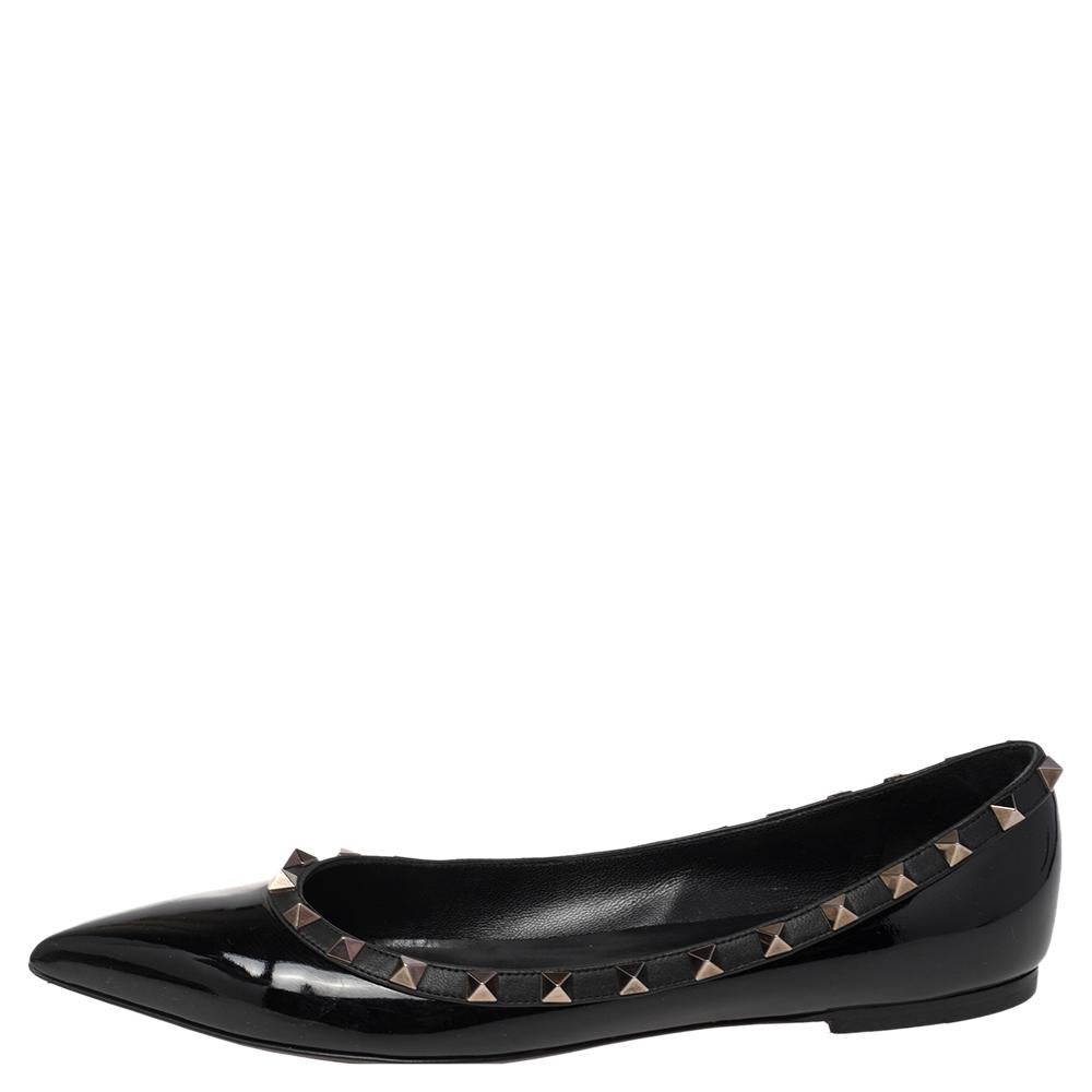 These designer ballet flats by Valentino are made of black patent leather and feature pointed toes and Rockstud accents in metal. They are lined well and set atop durable soles for lasting wear.