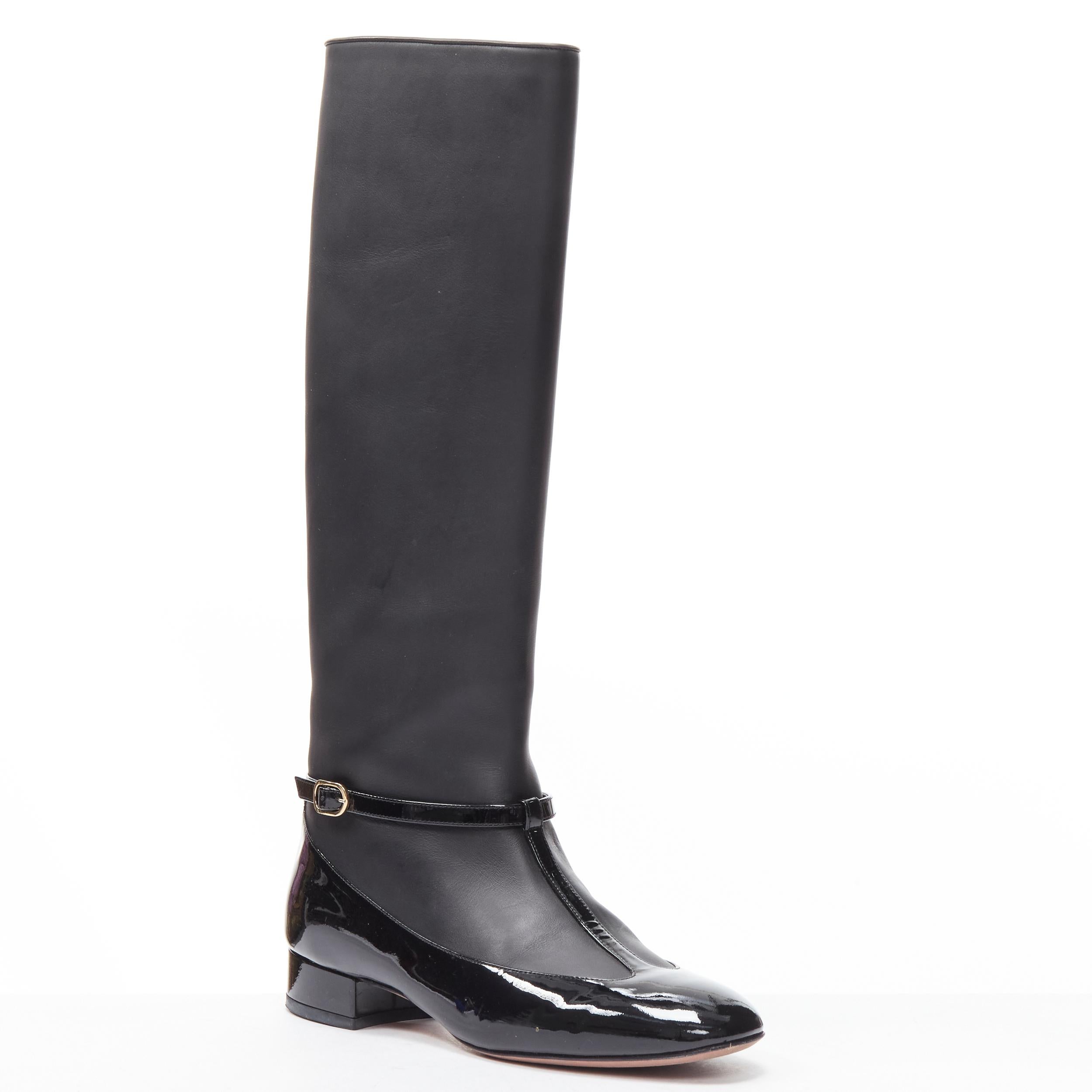 VALENTINO black patent T-strap Mary Jane leather pull on boot EU38
Reference: MELK/A00233
Brand: Valentino
Material: Leather
Color: Black
Pattern: Solid
Closure: Buckle
Extra Detail: Gold-tone hardware. 
Made in: Italy

CONDITION:
Condition:
