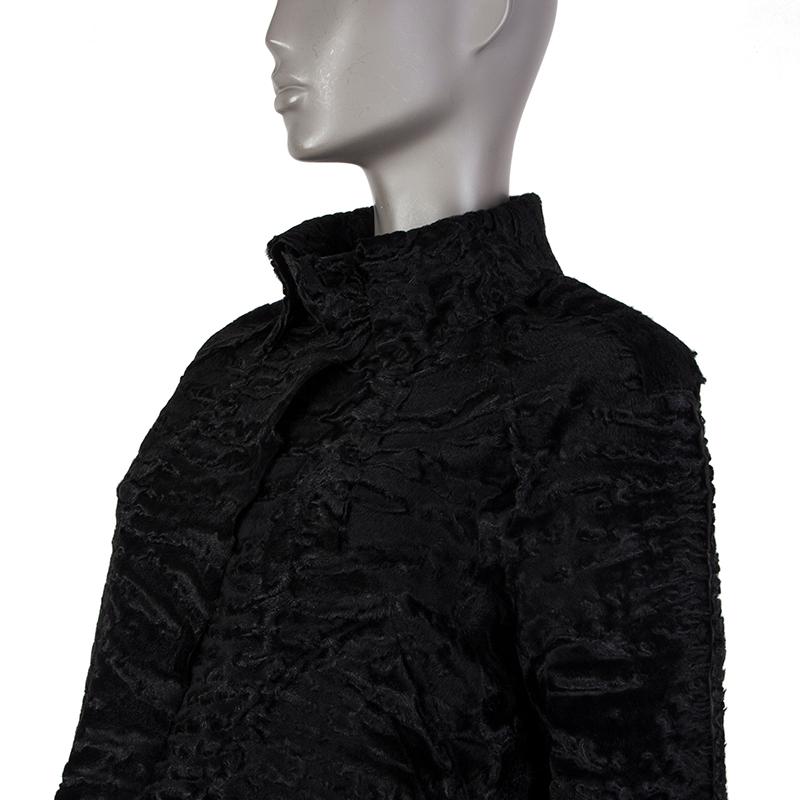 100% authentic Valentino military style jacket in black persian lamb fur. With flat collar, detachable neck band, epaulettes, raglan sleeves, two diagonal pockets on the front sides, snap cuff straps, and a-line cut. Closes wirh concealed snaps on
