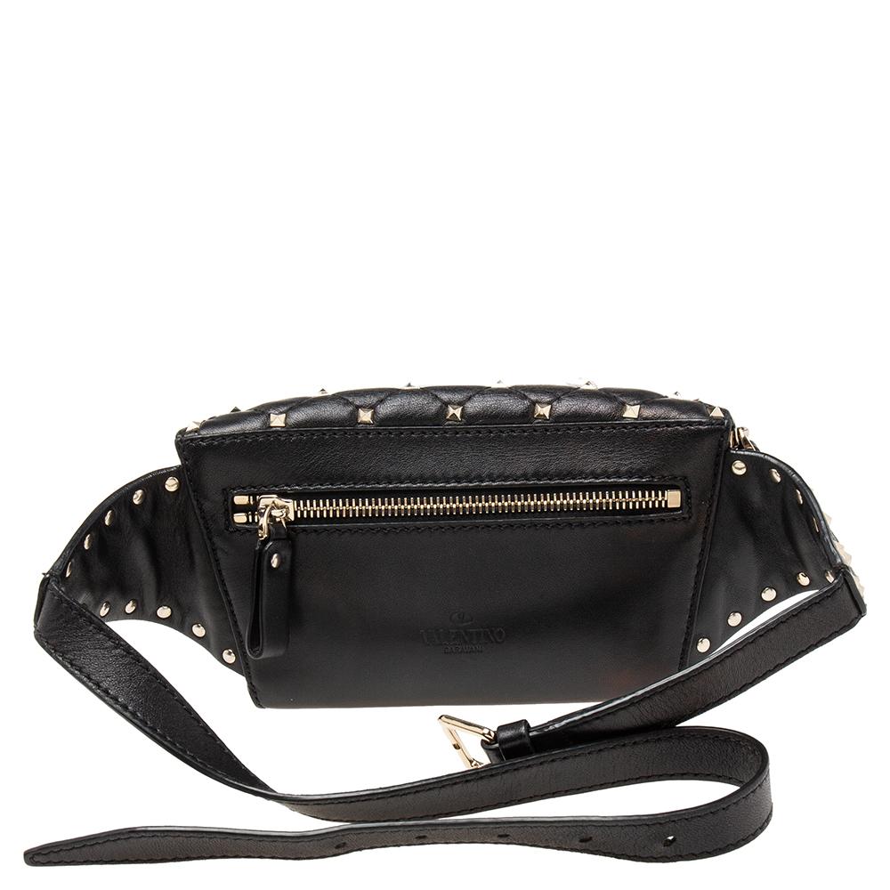 Exquisitely crafted from quilted leather, this Valentino bag has been designed with pretty Rockstud embellishments and a zip pocket to the rear. It is also equipped with a well-sized interior and a buckled strap is provided for you to style the