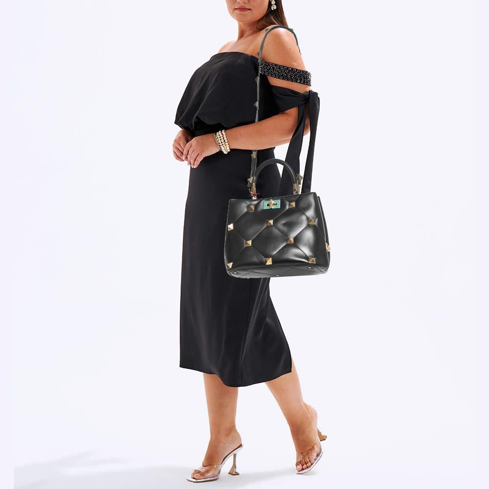 The Valentino Roman Stud bag exudes sophistication with its luxurious quilted texture and iconic Roman Stud detailing. Crafted from premium leather, it features a structured silhouette, top handle, and detachable shoulder strap, making it a timeless