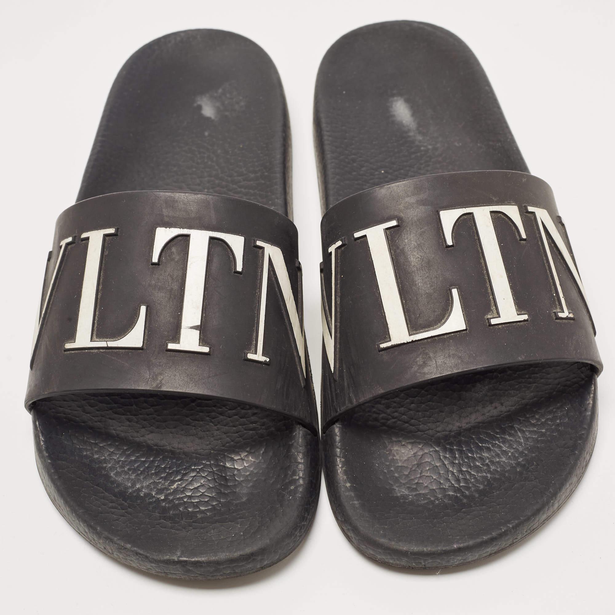 Valentino's rubber slides for women have the VLTN branding on the uppers. They're perfect for the beach, vacation days, or everyday use.

