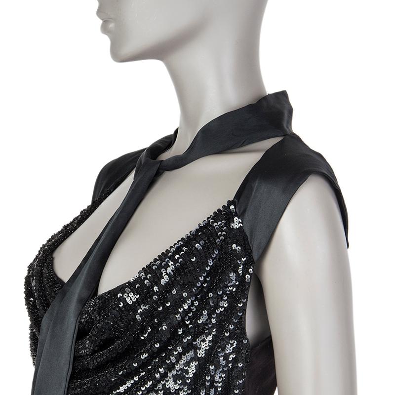 Valentino sequins cowl-neck tank top in black viscose (100%). Ties at the front with wide ribbon. Has been worn and is in excellent condition.

Tag Size 44
Size L
Shoulder Width 45cm (17.6in)
Bust 84cm (32.8in) to 98cm (38.2in)
Waist 76cm (29.6in)