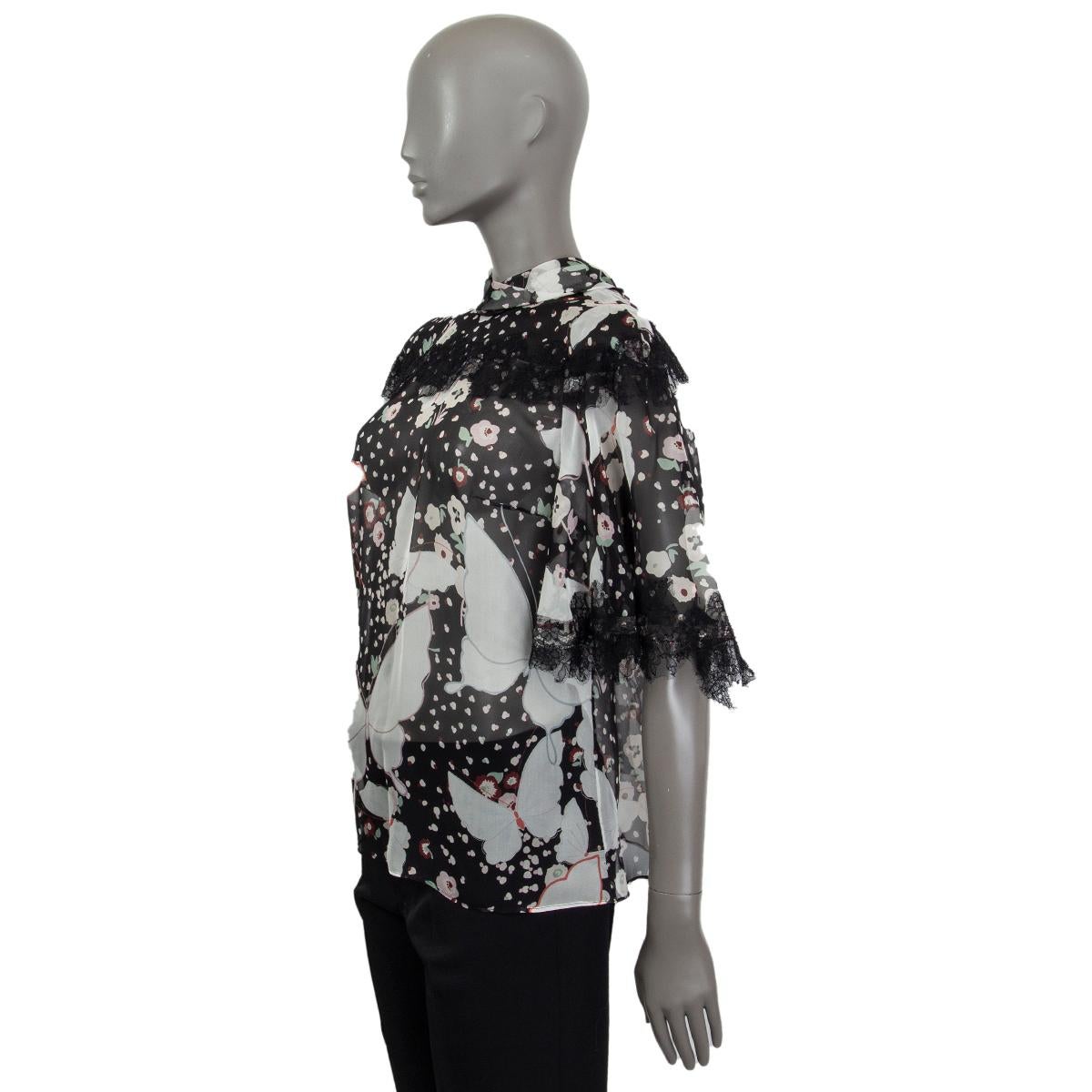Valentino pop butterflies sheer blouse in black, off-white, burgundy, red, lilac and sage flower and butterfly printed silk featuring lace trimming. Keyhole and bow on the back. Has been worn and is in excellent condition. 

Tag Size 42
Size