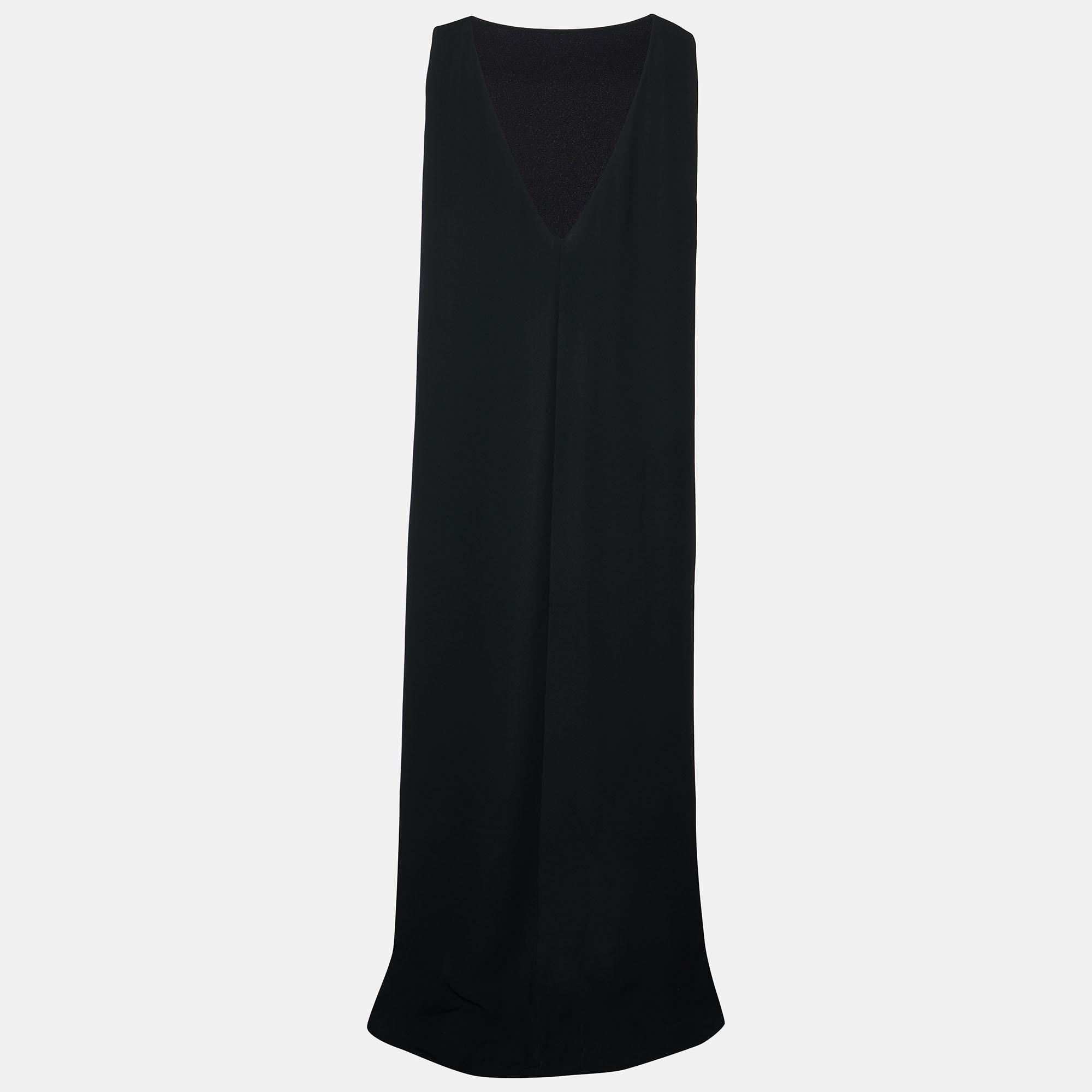 Crafted from sumptuous black silk crepe, this sleeveless maxi dress by Valentino exudes timeless elegance. Its flowing silhouette drapes gracefully, accentuating every movement. The plunging neckline adds a touch of allure while the simplicity of
