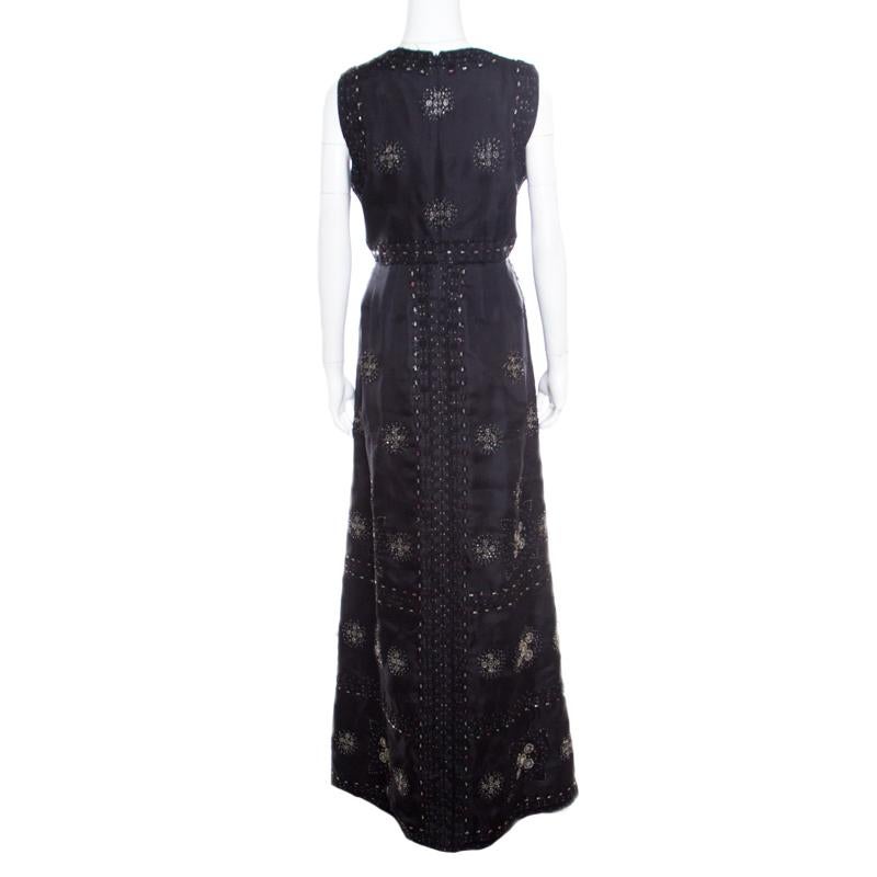This gorgeous Valentino gown is perfect for a sophisticated and chic look! The black creation is made of 100% silk and features a flattering silhouette. It flaunts a subtle embroidery detailing all over and is embellished with beads. Pair it with