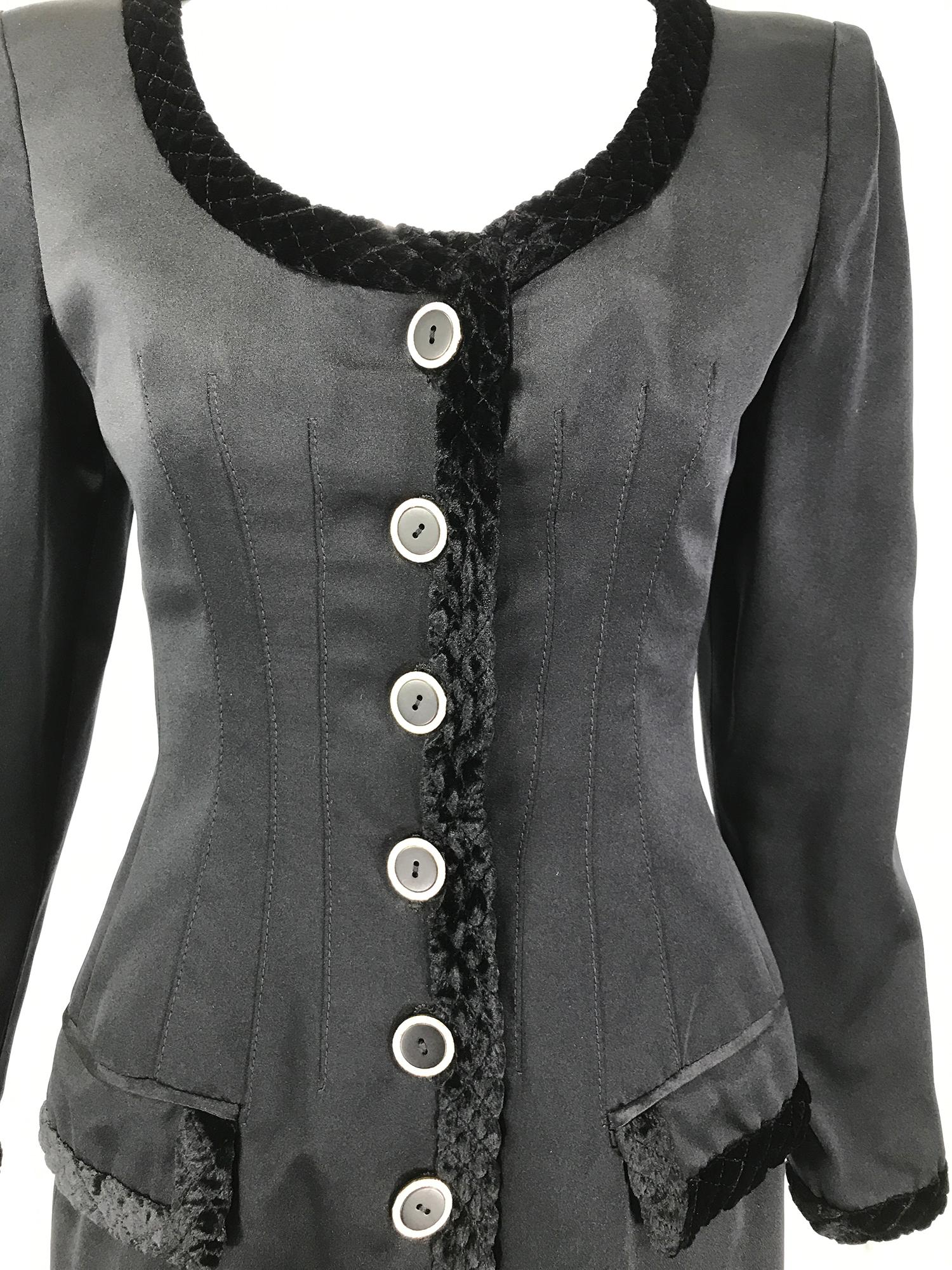Valentino Boutique black silk fitted, jewel button evening jacket from the 1990s. Single breasted jacket closes at the front with black rhinestone outlined buttons. The jacket is trimmed with quilted black velvet at the low scooped  neckline, front