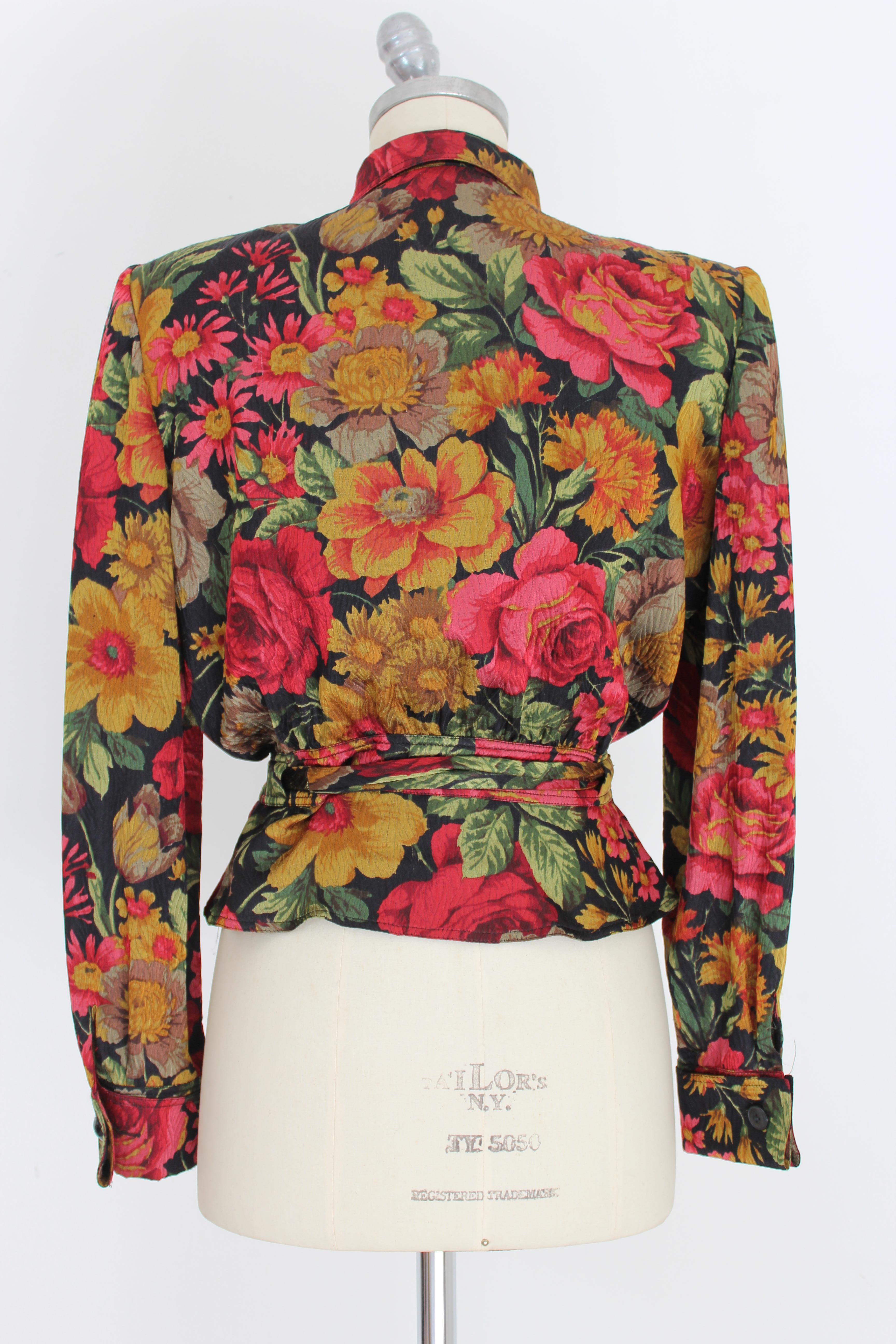 Valentino Miss V 80's vintage women's shirt. Short pattern at the waist, 100% silk, black with multicolored flowers. Bow at the waist and on the collar, cuffs with cufflinks. Made in Italy. Excellent vintage condition.

Size: 42 It 8 Us 10