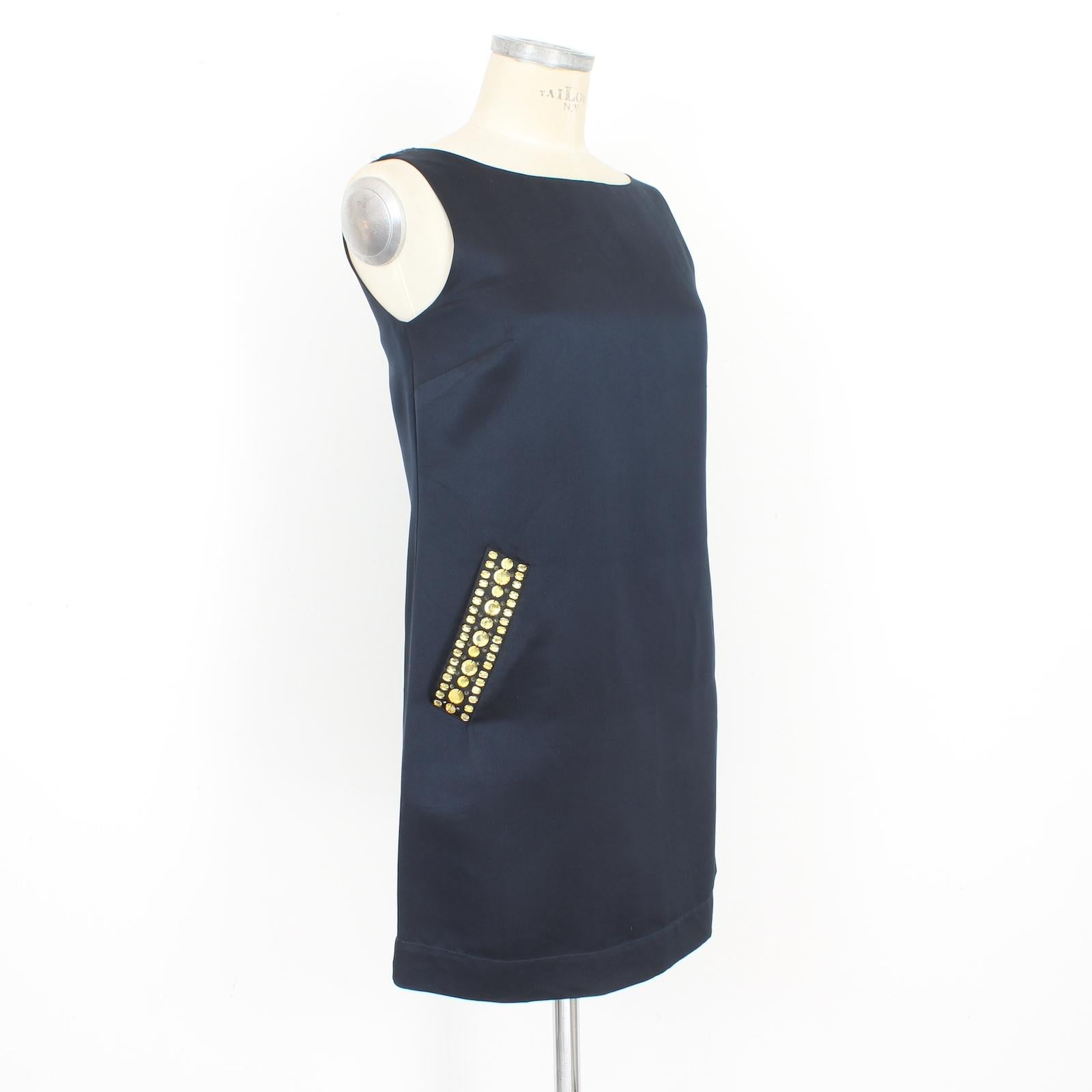 Valentino red evening dress 2000s. Sheath black dress, sleeveless, crew neck, special pockets covered with yellow rhinestones. 100% silk fabric, internally lined. There are some small pulled threads.

Size: 40 It 6 Us 8 Uk

Shoulder: