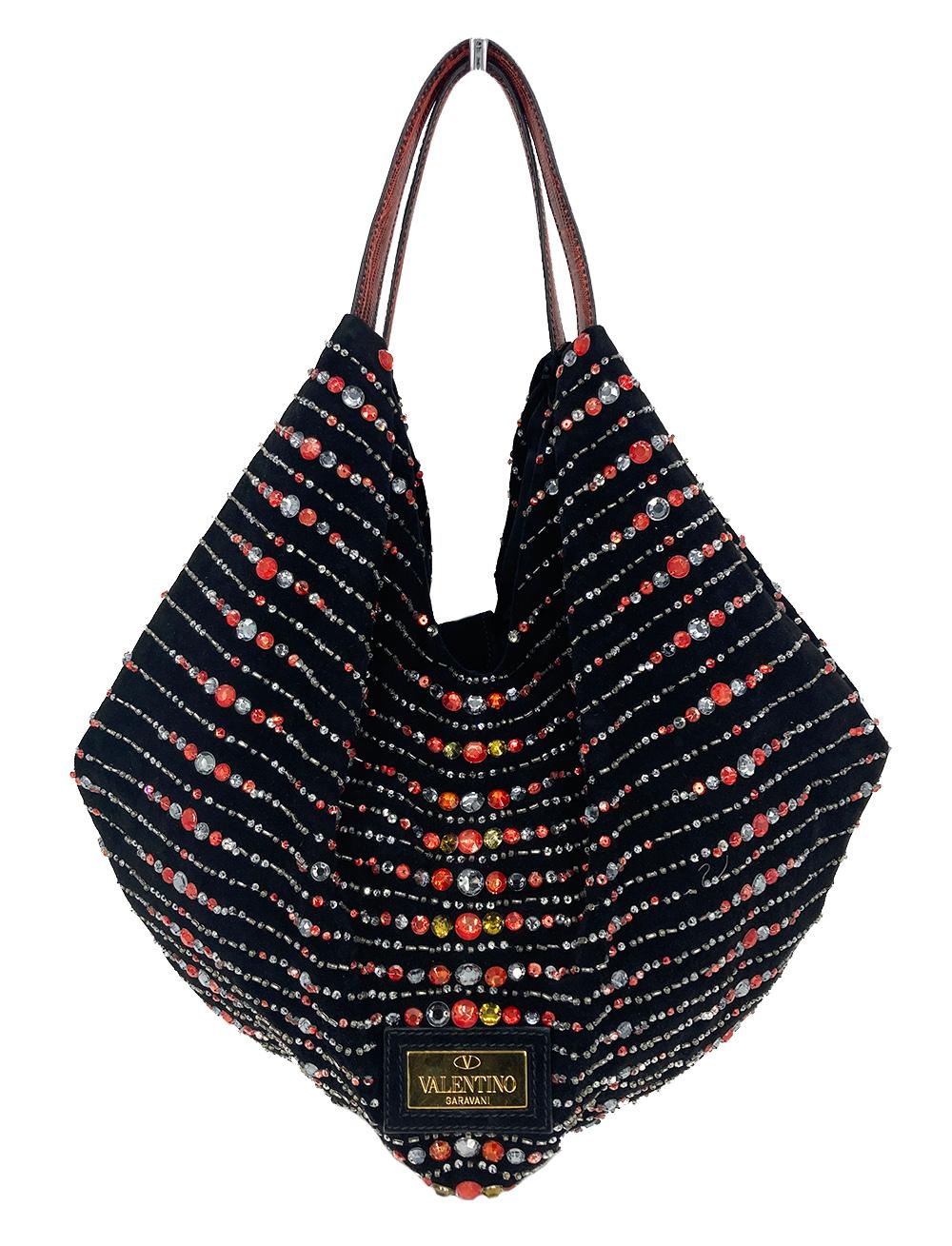 Valentino Black Suede Rhinestone Beaded Tote in good condition. Black suede exterior trimmed with multi color rhinestones and beads in silver, red, gray and yellow trimmed with a front suede bow accent and red lizard leather shoulder straps. Unique