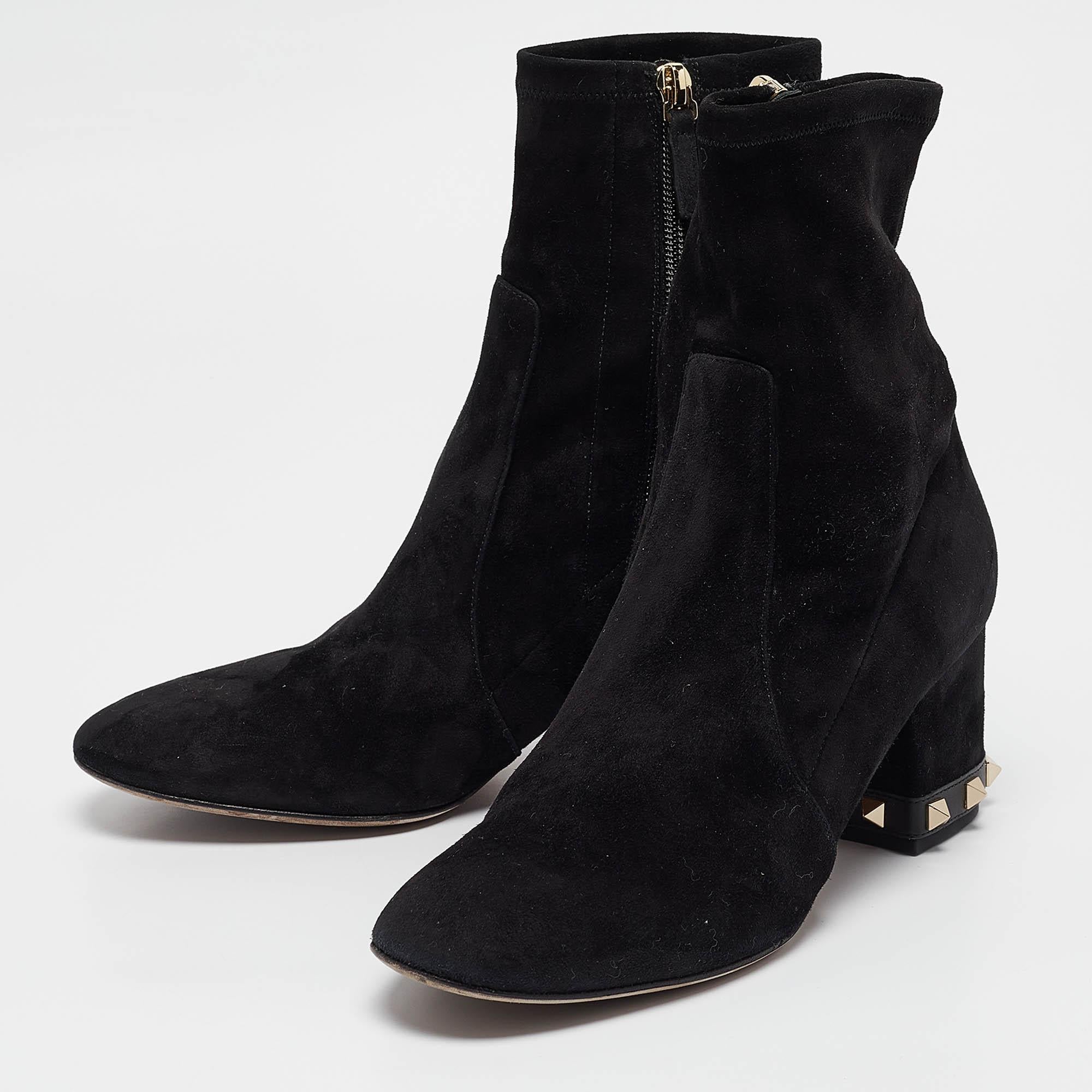 Youll find these Valentino black suede ankle boots a reliable style companion. The classic shape clean details and block heels make them perfect for fall and beyond.