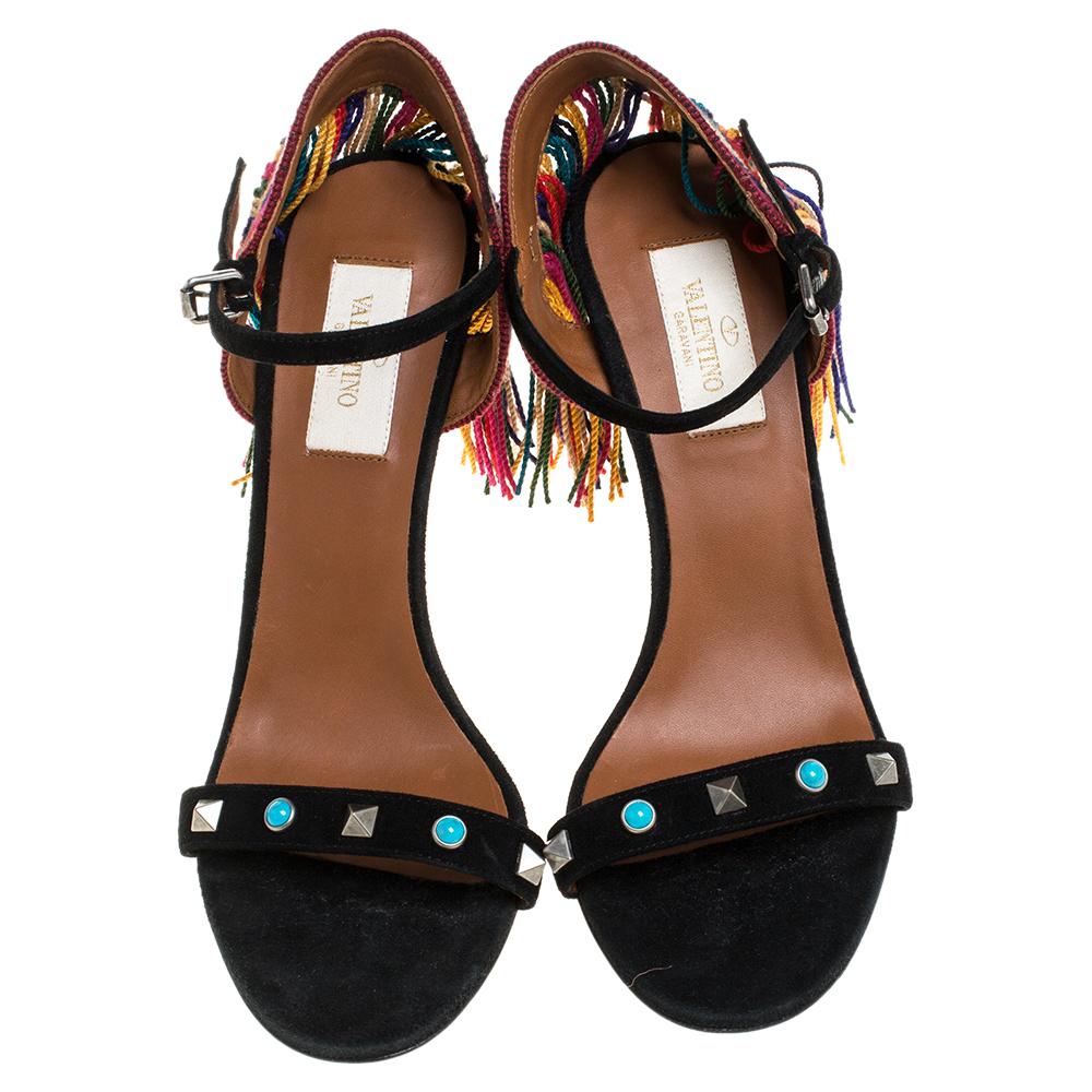 Valentino gives a boho twist to the classy silhouette in these stunning sandals. Crafted from suede, they feature multicolor fringe detailing at the heel counters that add character to them and move elegantly as you walk. The straps on the uppers
