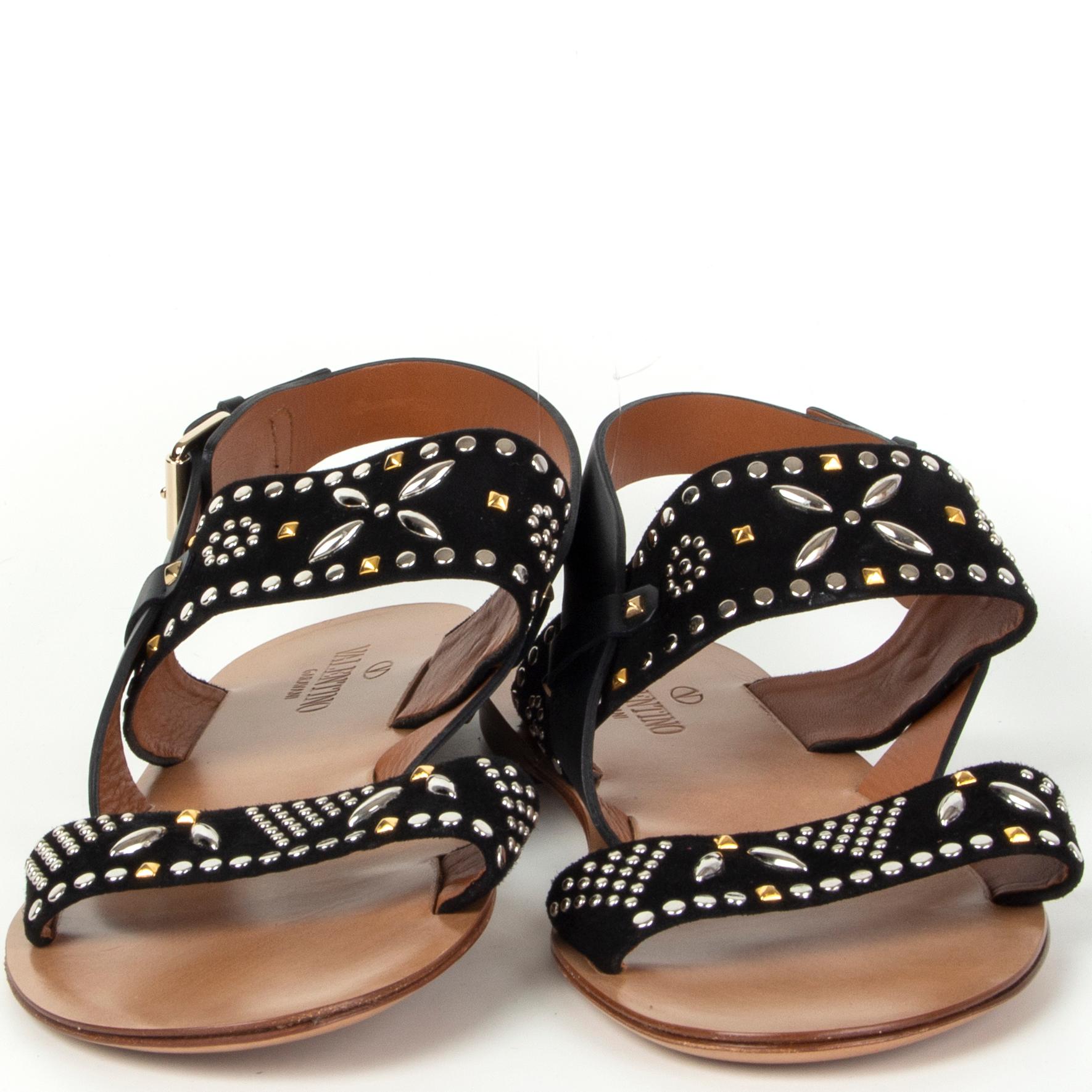 100% authentic Valentino studded flat sandals in black suede and leather. Bradn new. Come with dust bag. 

Measurements
Imprinted Size	40
Shoe Size	40
Inside Sole	26cm (10.1in)
Width	7.5cm (2.9in)
Hardware	Silver & Gold-Tone

All our listings