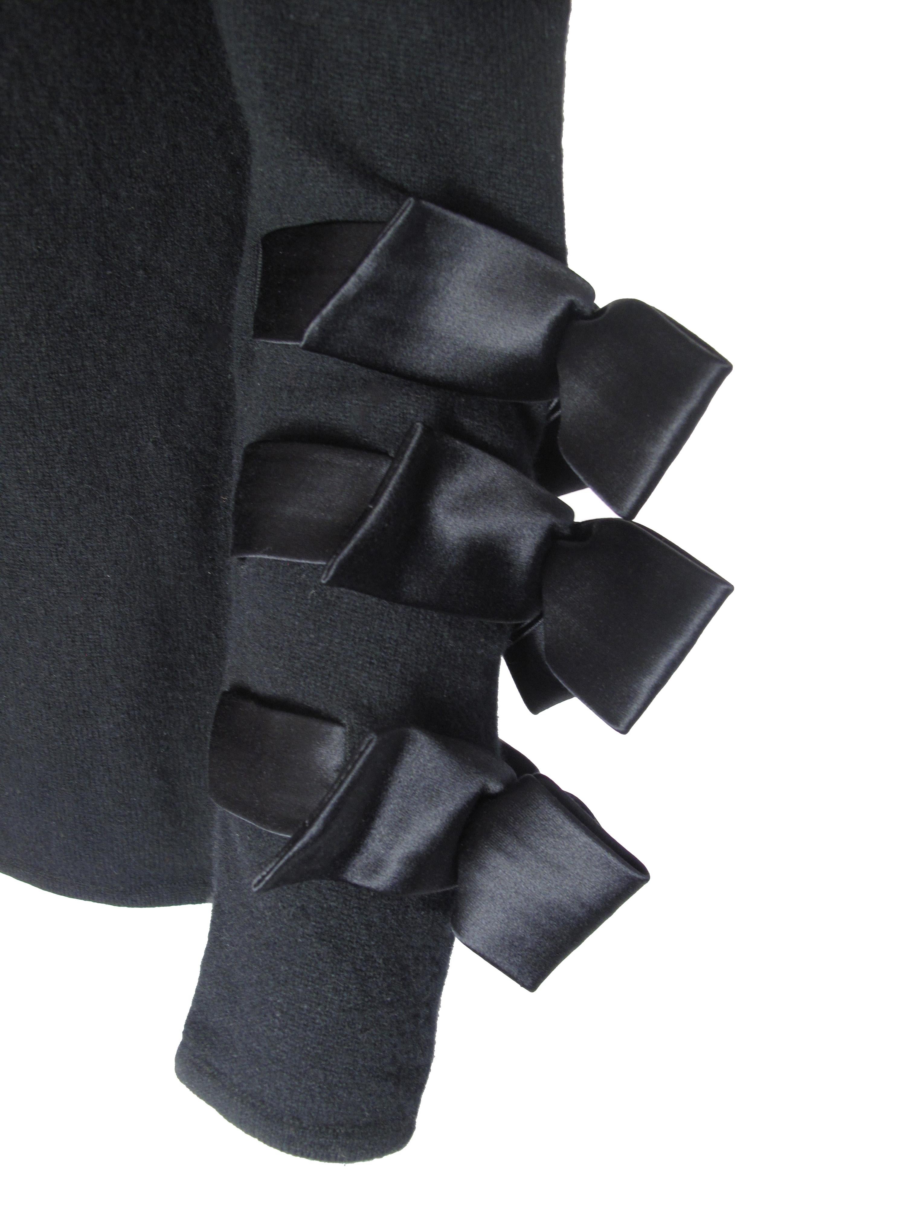Valentino black sweater with ribbon bow detail on sleeve. Condition: Very good. Size M