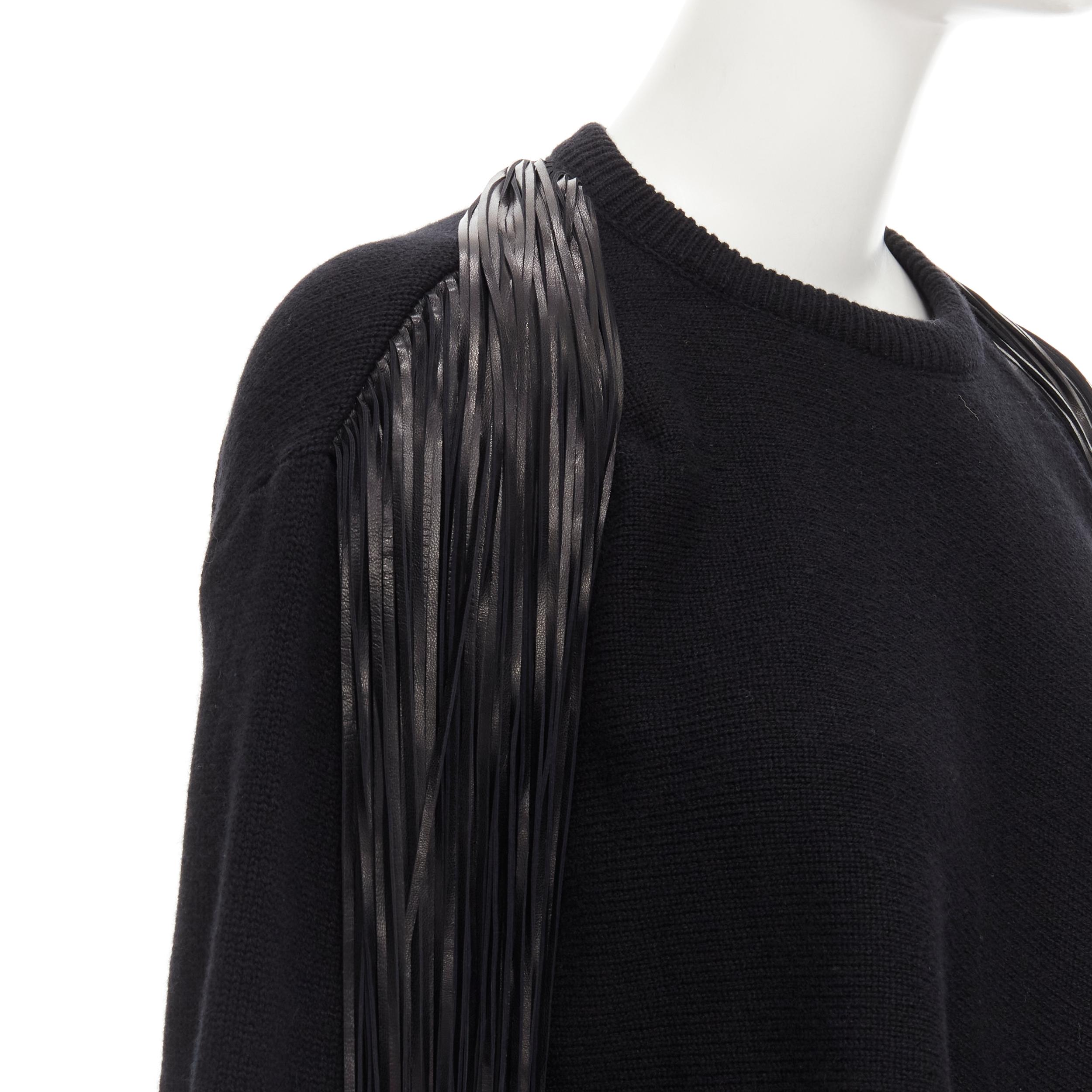 VALENTINO black virgin wool cashmere leather fringe wrap scarf sweater M 
Reference: AEMA/A00060 
Brand: Valentino 
Material: Wool 
Color: Black 
Pattern: Solid 
Extra Detail: Leather fringe trim at back. Attached scarf that can be draped at front