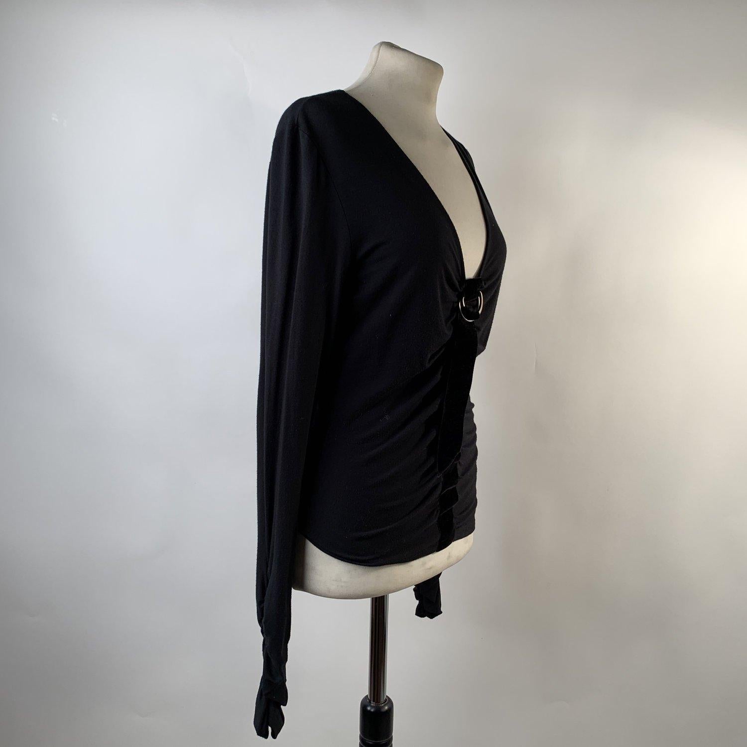 MATERIAL: Viscose COLOR: Black MODEL: Long Sleeve Top GENDER: Women SIZE: Medium COUNTRY OF MANUFACTURE: Italy Condition CONDITION DETAILS: B :GOOD CONDITION - Some light wear of use - gently used- Previously worn with moderate wash wear/fade and or