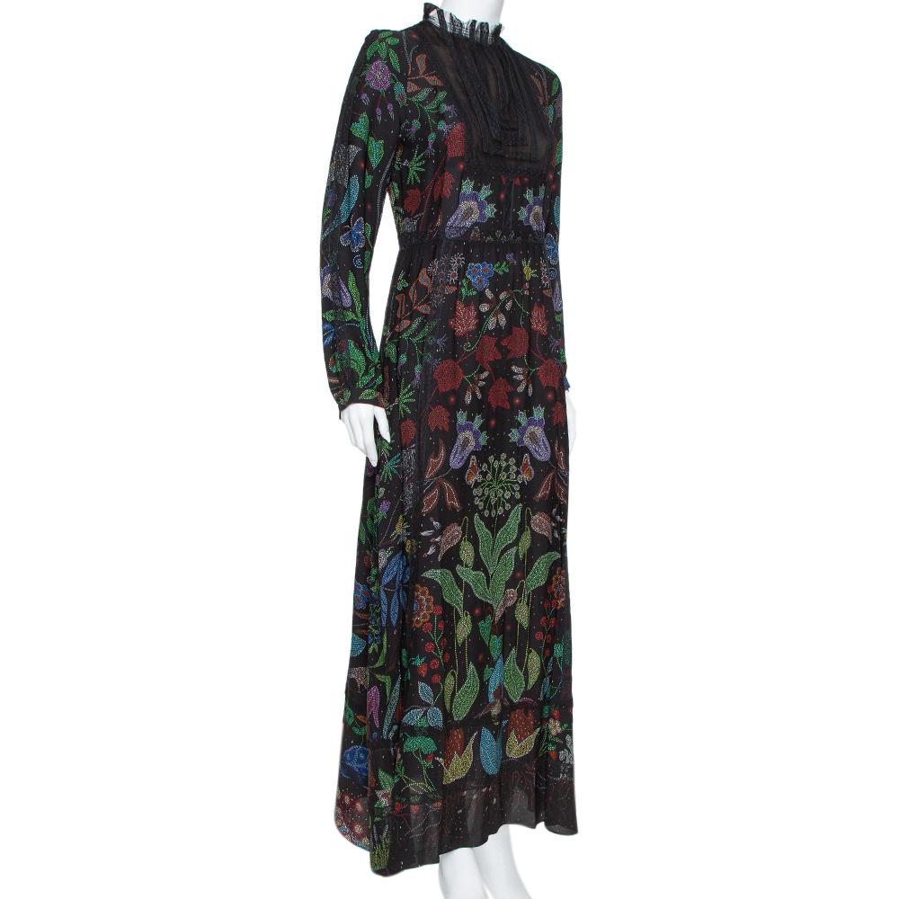 Valentino has designed this maxi dress to light up your days in style. Tailored beautifully, the dress features an elegant neckline covered in lace, Watersong prints, zip closure, and long sleeves. The beautiful creation can be teamed with a wide