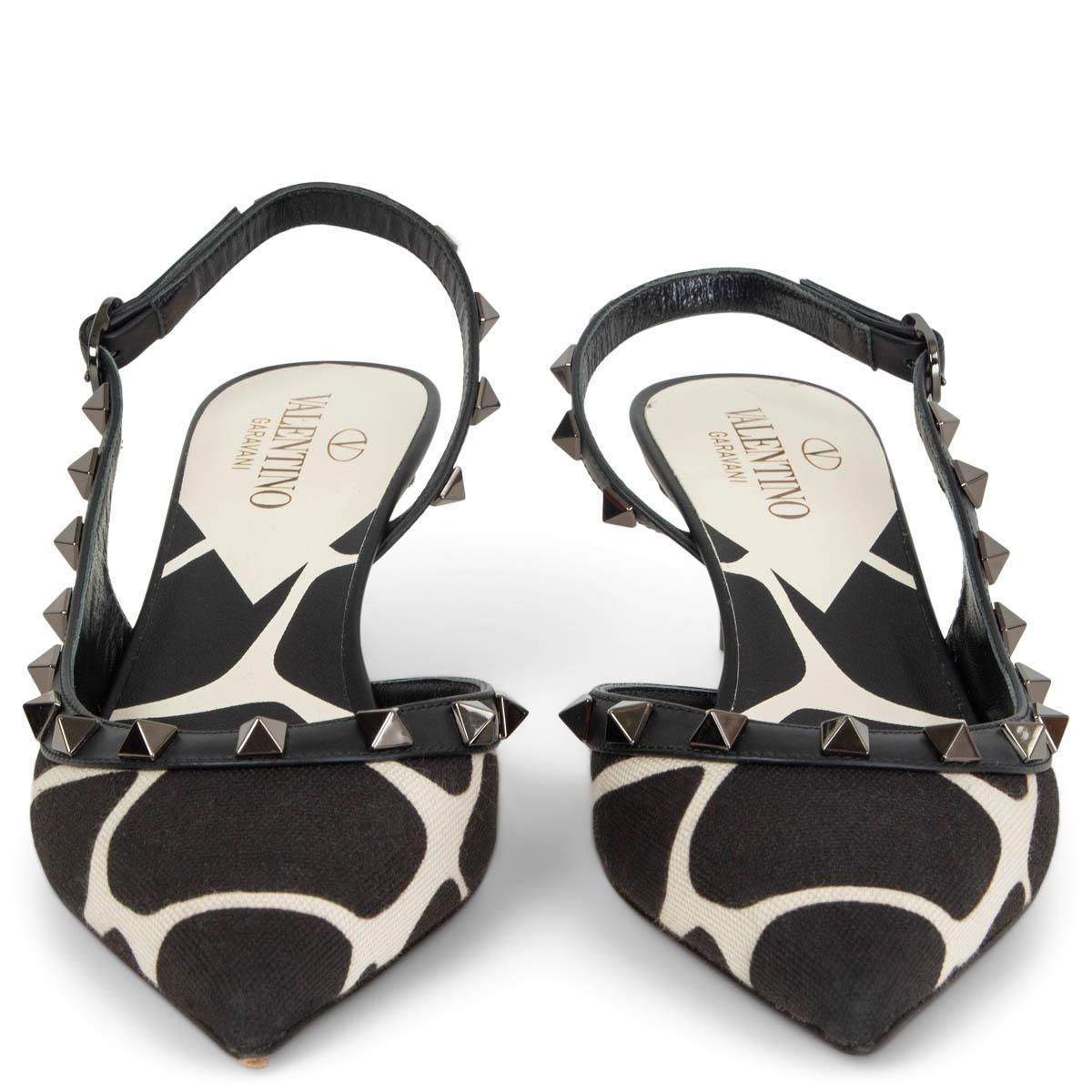 100% authentic Valentino Rockstud d'Orsay slingback pumps in black and white giraffe print canvas with leather trim and signature pyramid rockstuds in gunmetal. Brand new. Come with dust bag. 

Measurements
Imprinted Size	36
Shoe Size	36
Inside