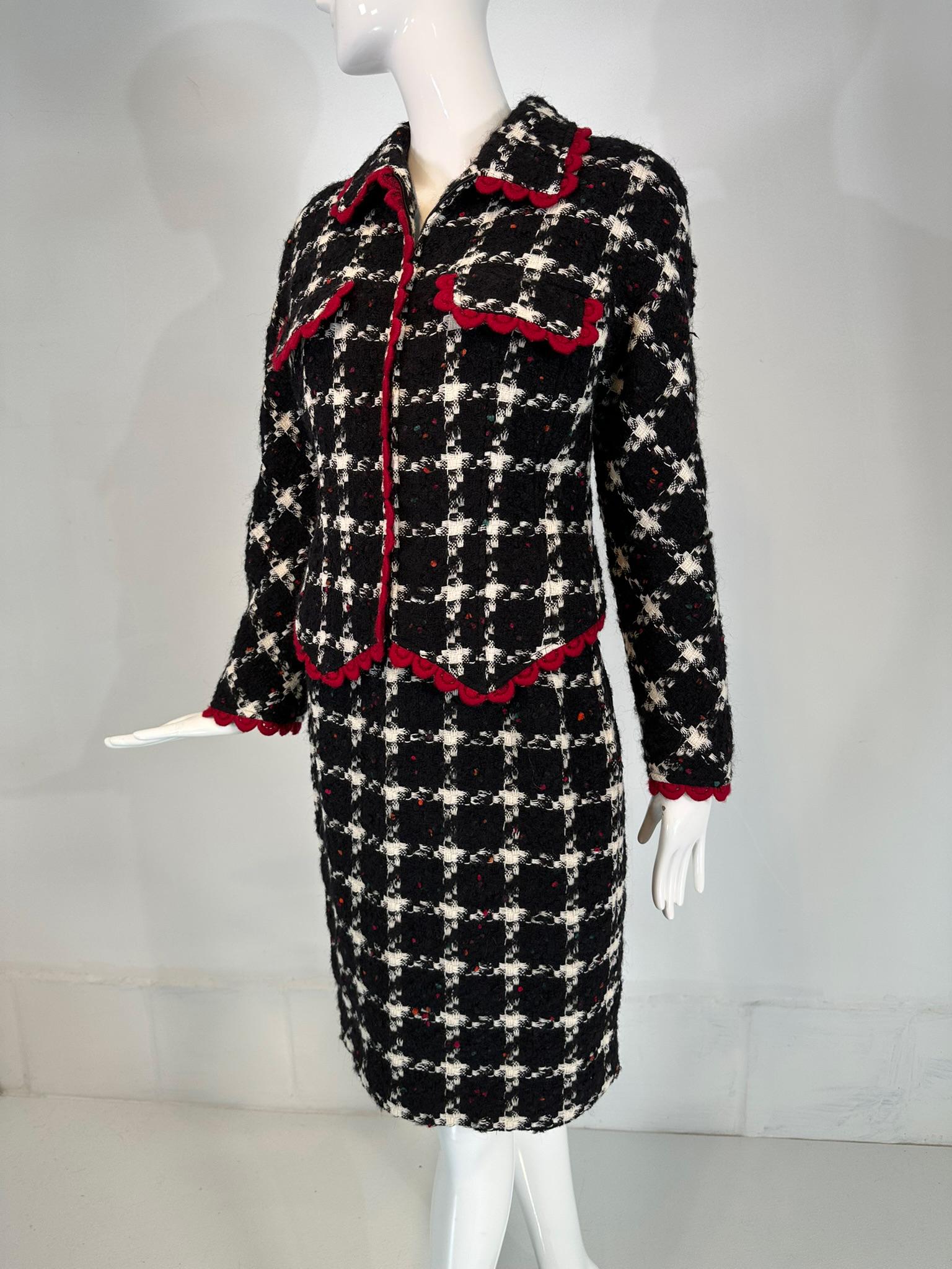 Valentino chunky weave black & white check with red crochet trim zipper front jacket, skirt suit. A beautiful suit in chunky weave black & white wool, the jacket is trimmed in red wool crochet. Wing collar jacket closes at the front with a zipper,