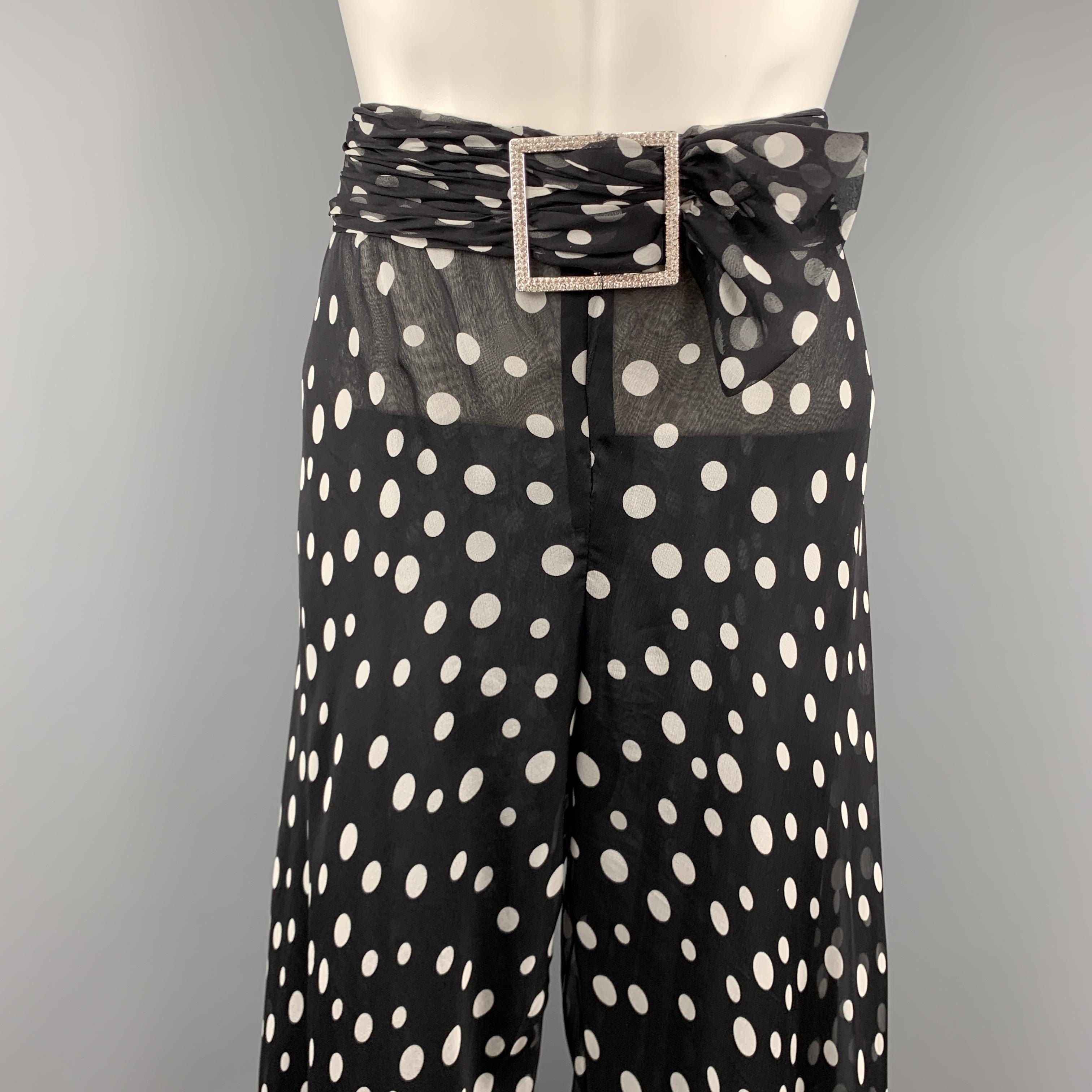 VALENTINO dress pants come in black and white polka dot sheer chiffon with wide ruffled hem legs, gathered waistband with silver tone rhinestone buckle, and black chiffon liner. Made in Italy.

Excellent Pre-Owned Condition.
Marked: (no
