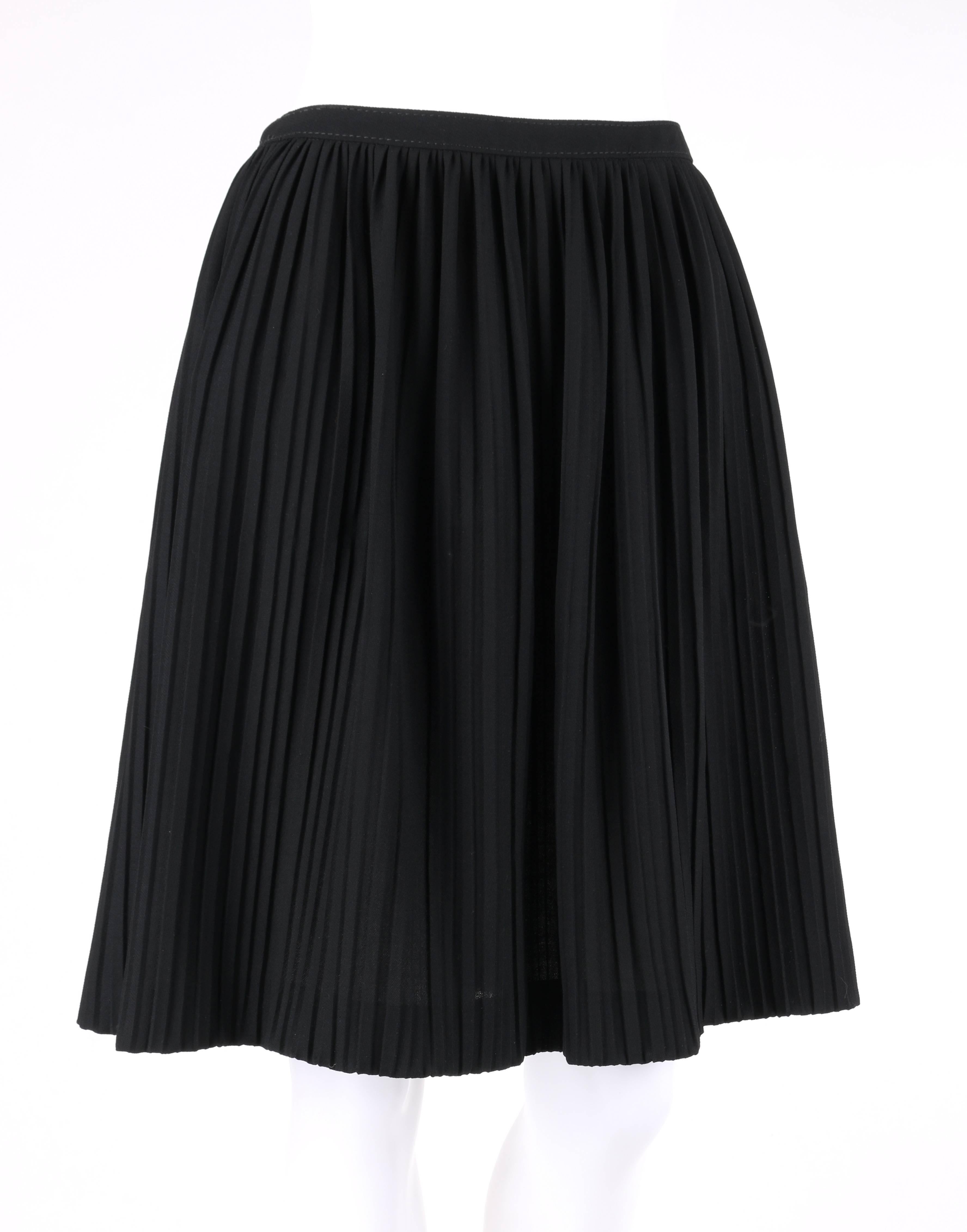 Valentino black wool crepe accordion pleated knee length skirt. Thin banded waist. Center back invisible zipper with hook and eye closure at top. Knee length. Unlined. Marked Fabric Content: 